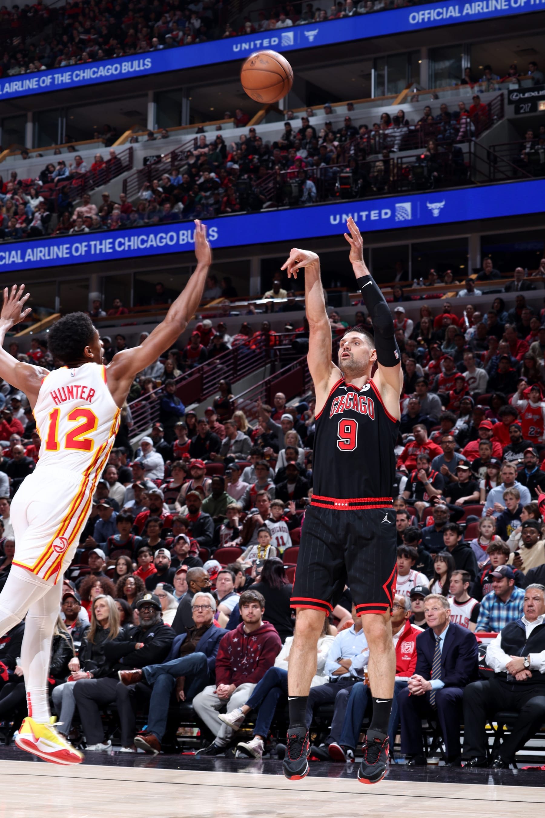 CHICAGO, IL - APRIL 17: Nikola Vucevic #9 of the Chicago Bulls shoots a three point basket against the Atlanta Hawks during the 2024 Play-In Tournament  on April 17, 2024 at United Center in Chicago, Illinois. NOTE TO USER: User expressly acknowledges and agrees that, by downloading and or using this photograph, User is consenting to the terms and conditions of the Getty Images License Agreement. Mandatory Copyright Notice: Copyright 2024 NBAE (Photo by Jeff Haynes/NBAE via Getty Images)