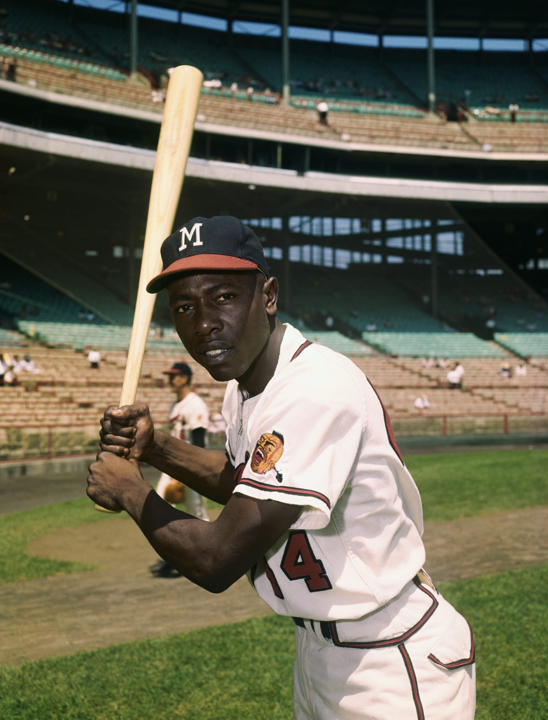 7/1959-Hank Aaron in a batting pose, wearing a Milwaukee Braves uniform.