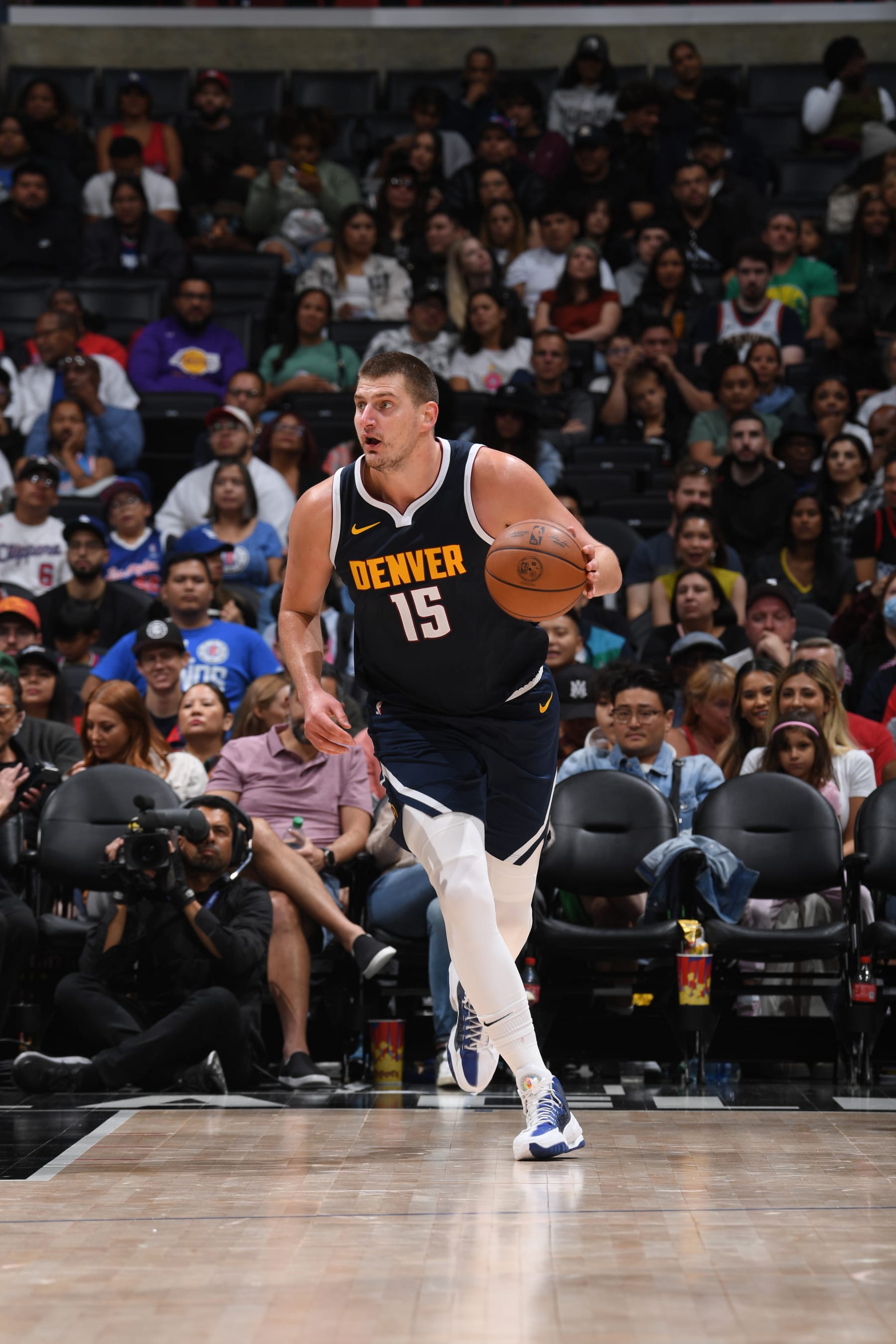 LOS ANGELES, CA - OCTOBER 19: Nikola Jokic #15 of the Denver Nuggets dribbles the ball during the preseason game on October 19, 2023 at Crypto.Com Arena in Los Angeles, California. NOTE TO USER: User expressly acknowledges and agrees that, by downloading and/or using this Photograph, user is consenting to the terms and conditions of the Getty Images License Agreement. Mandatory Copyright Notice: Copyright 2023 NBAE (Photo by Juan Ocampo/NBAE via Getty Images)