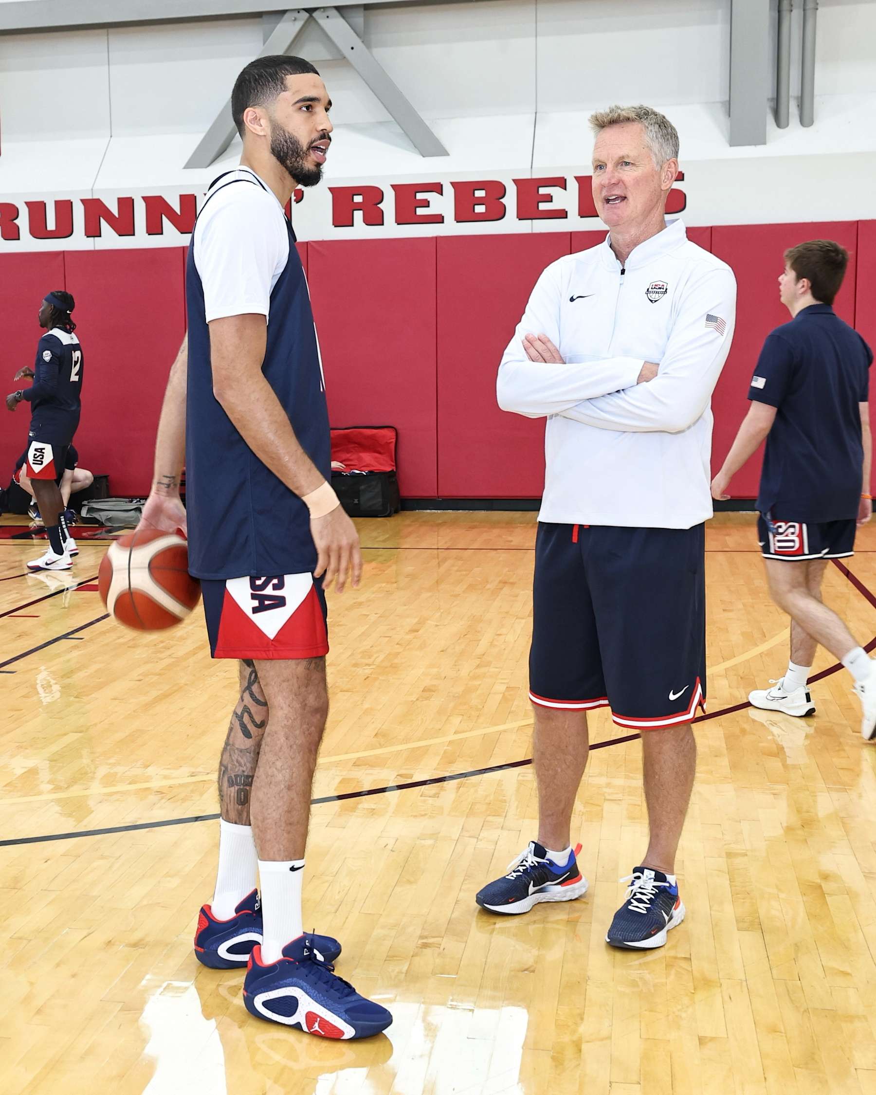 LAS VEGAS, NV - JULY 8:   Jayson Tatum #10 of the USAB Mens Team and Steve Kerr Assistant Coach of the USAB Mens Team looks on during the USAB Men's Training Camp on July 8, 2024 at UNLV in Las Vegas, Nevada. NOTE TO USER: User expressly acknowledges and agrees that, by downloading and or using this photograph, User is consenting to the terms and conditions of the Getty Images License Agreement. Mandatory Copyright Notice: Copyright 2024 NBAE (Photo by Jim Poorten/NBAE via Getty Images)