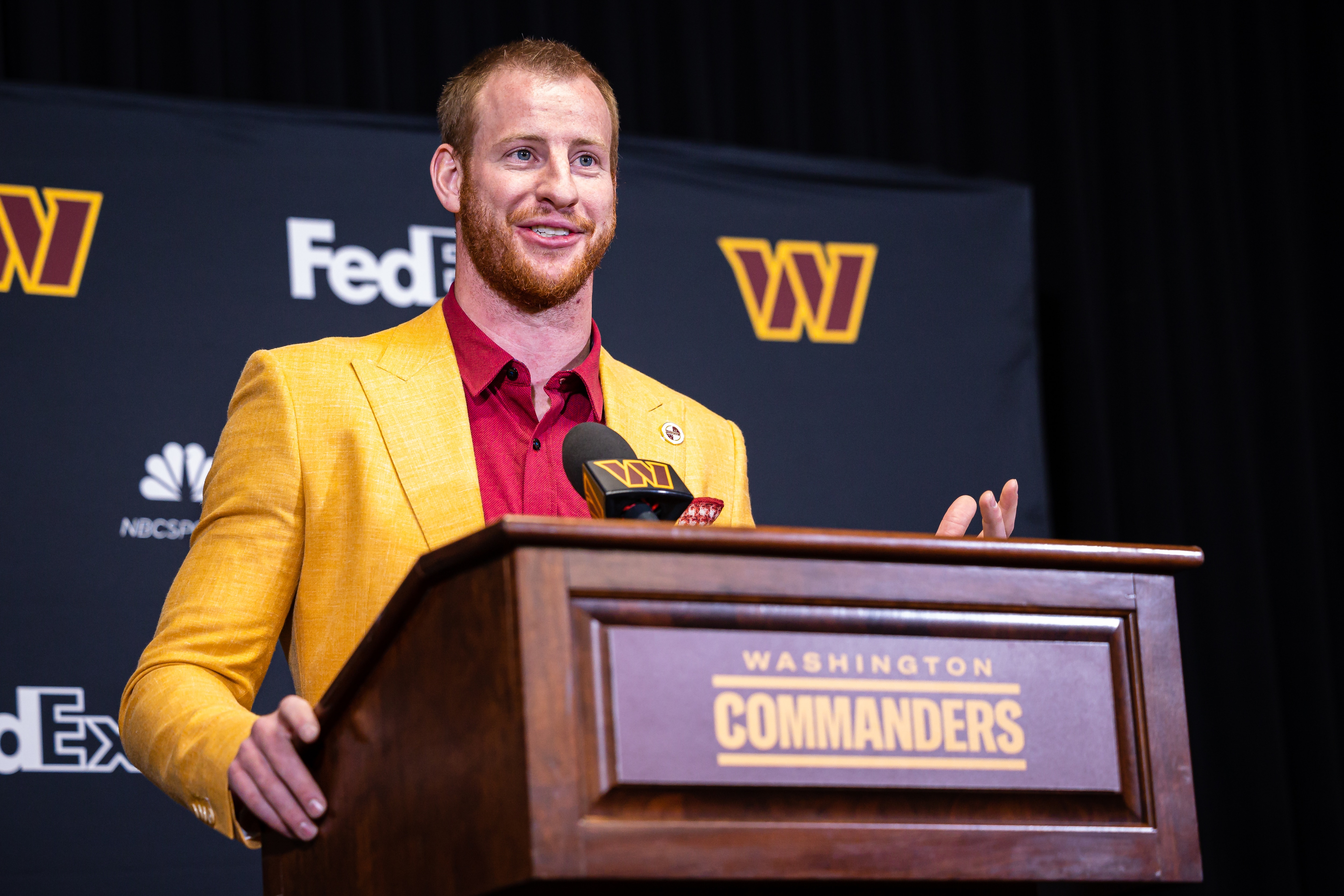 ASHBURN, VA - MARCH 17: Quarterback Carson Wentz of the Washington Commanders is introduced at Inova Sports Performance Center on March 17, 2022 in Ashburn, Virginia. (Photo by Scott Taetsch/Getty Images)