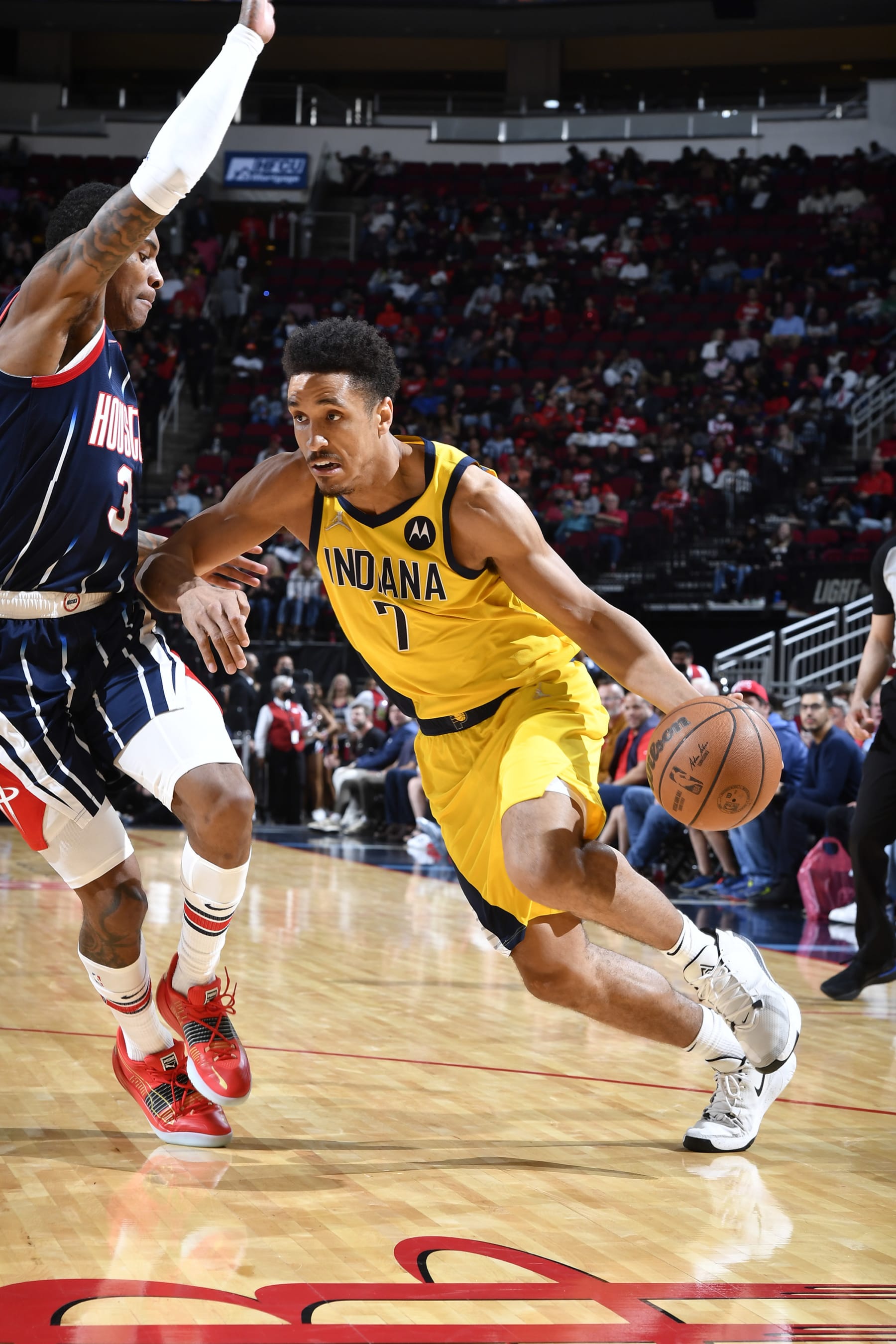 HOUSTON, TX - MARCH 18: Malcolm Brogdon #7 of the Indiana Pacers handles the ball during the game against the Houston Rockets  on March 18, 2022 at the Toyota Center in Houston, Texas. NOTE TO USER: User expressly acknowledges and agrees that, by downloading and or using this photograph, User is consenting to the terms and conditions of the Getty Images License Agreement. Mandatory Copyright Notice: Copyright 2022 NBAE (Photo by Logan Riely/NBAE via Getty Images)