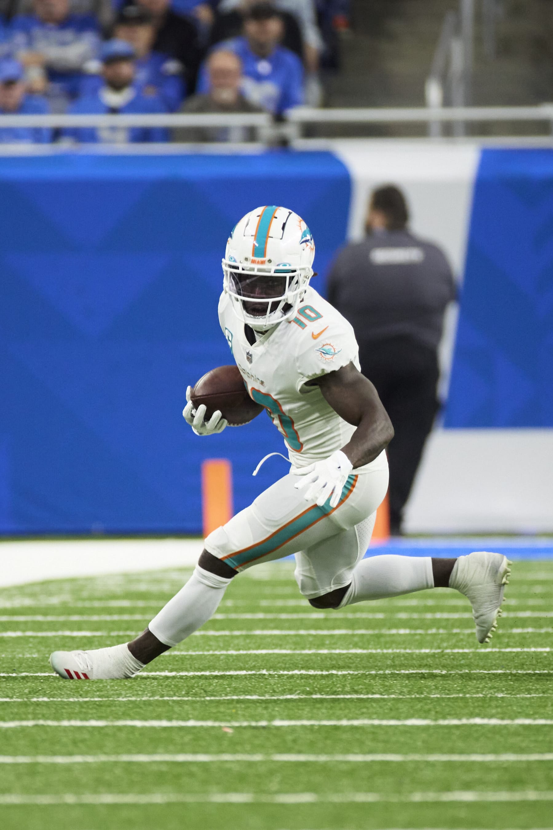 Miami Dolphins wide receiver Tyreek Hill (10) runs the ball against the Detroit Lions during an NFL football game, Sunday, Oct. 30, 2022, in Detroit. (AP Photo/Rick Osentoski)