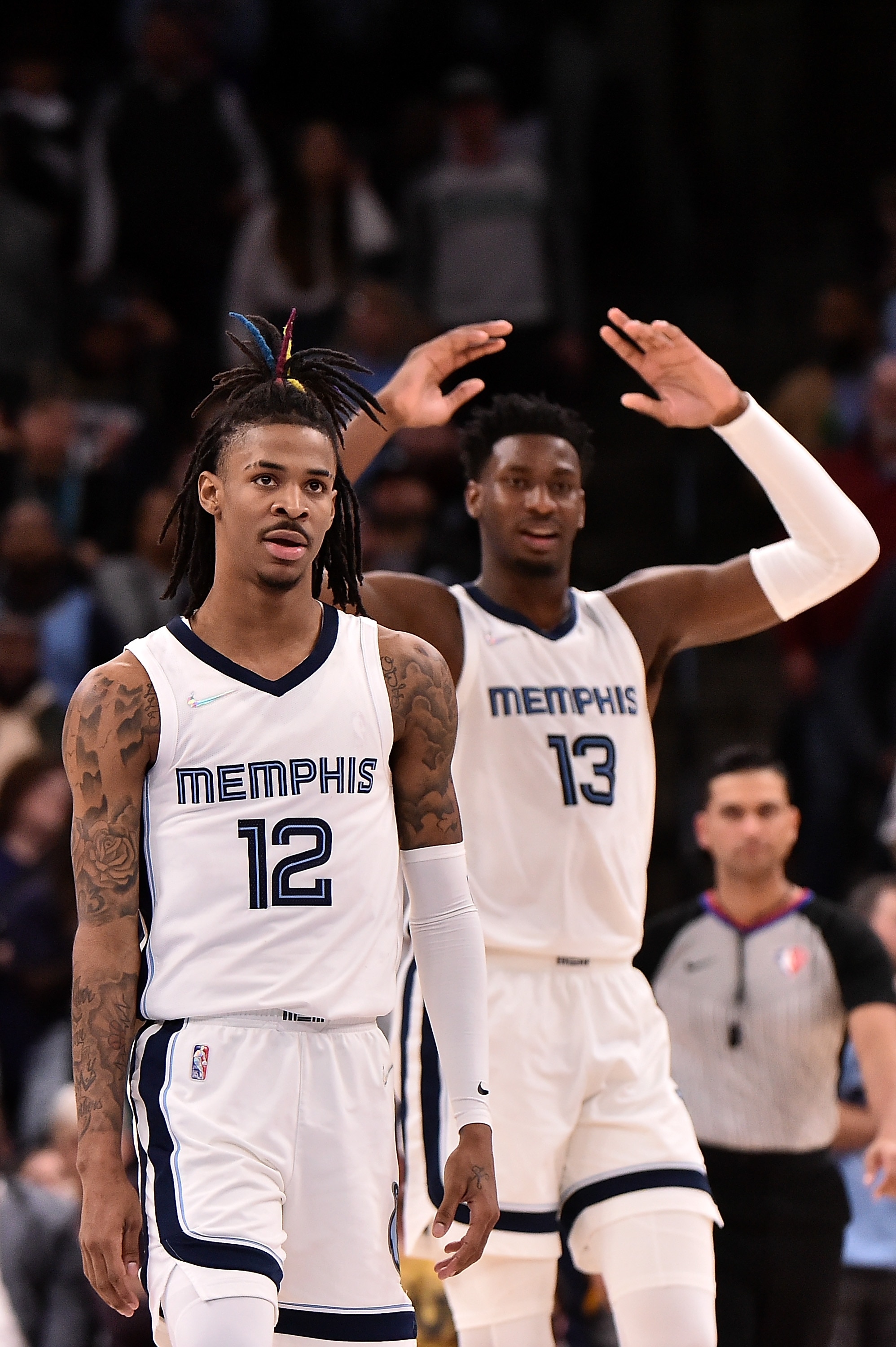 MEMPHIS, TENNESSEE - MARCH 11: Ja Morant #12 of the Memphis Grizzlies and Jaren Jackson Jr. #13 of the Memphis Grizzlies react during the game against the New York Knicks at FedExForum on March 11, 2022 in Memphis, Tennessee. NOTE TO USER: User expressly acknowledges and agrees that , by downloading and or using this photograph, User is consenting to the terms and conditions of the Getty Images License Agreement.  (Photo by Justin Ford/Getty Images)