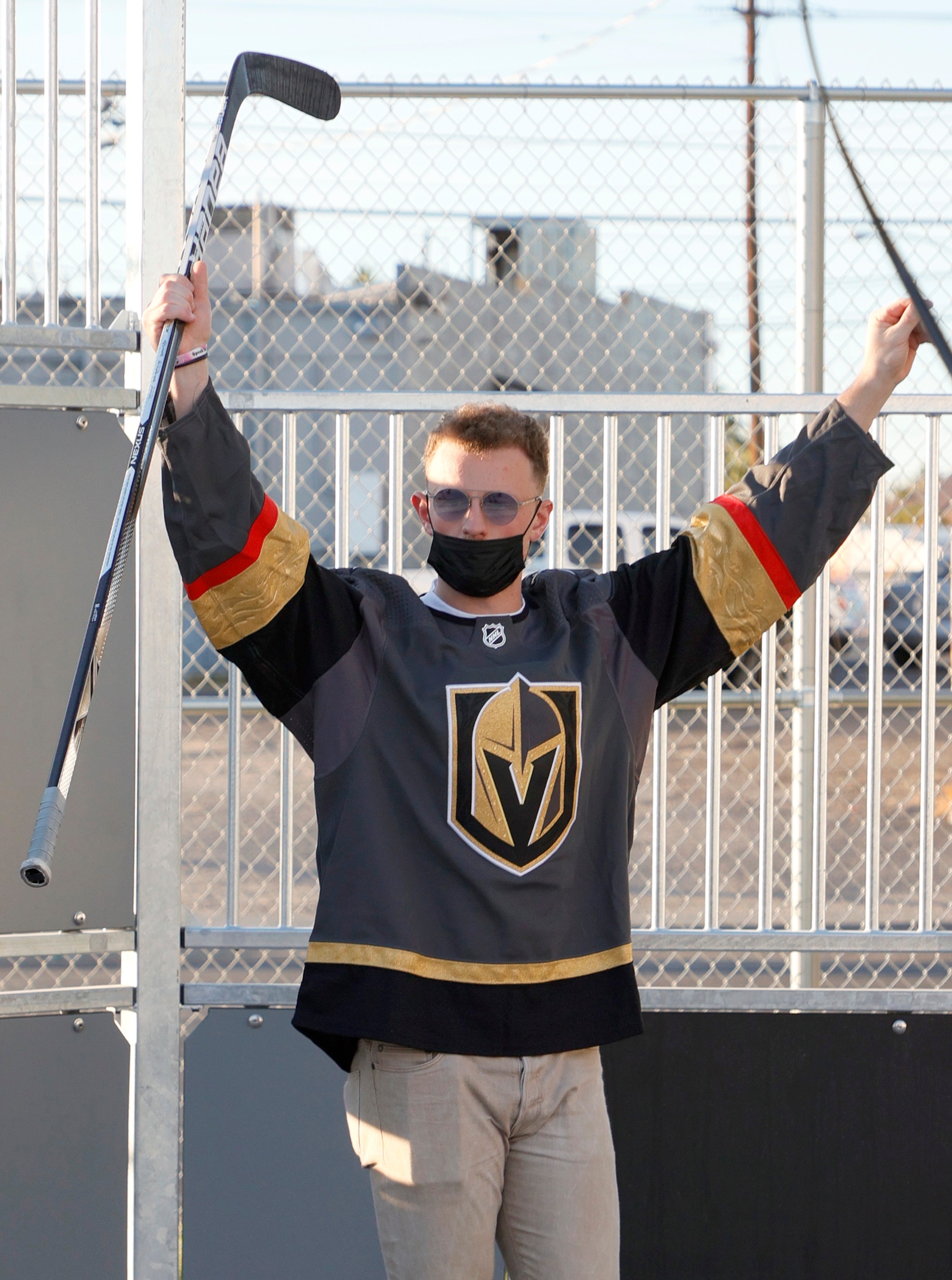 LAS VEGAS, NEVADA - NOVEMBER 08:  Newly acquired Vegas Golden Knights player Jack Eichel celebrates a kid's goal as he participates in a youth clinic at a ball hockey rink at the Boys & Girls Clubs of Southern Nevada on November 8, 2021 in North Las Vegas, Nevada. The Golden Knights traded for Eichel and a conditional draft pick from the Buffalo Sabres in exchange for Alex Tuch, Peyton Krebs and two conditional draft picks on November 4. Eichel is expected to be available four months after undergoing an artificial disc replacement surgery in his neck.  (Photo by Ethan Miller/Getty Images)