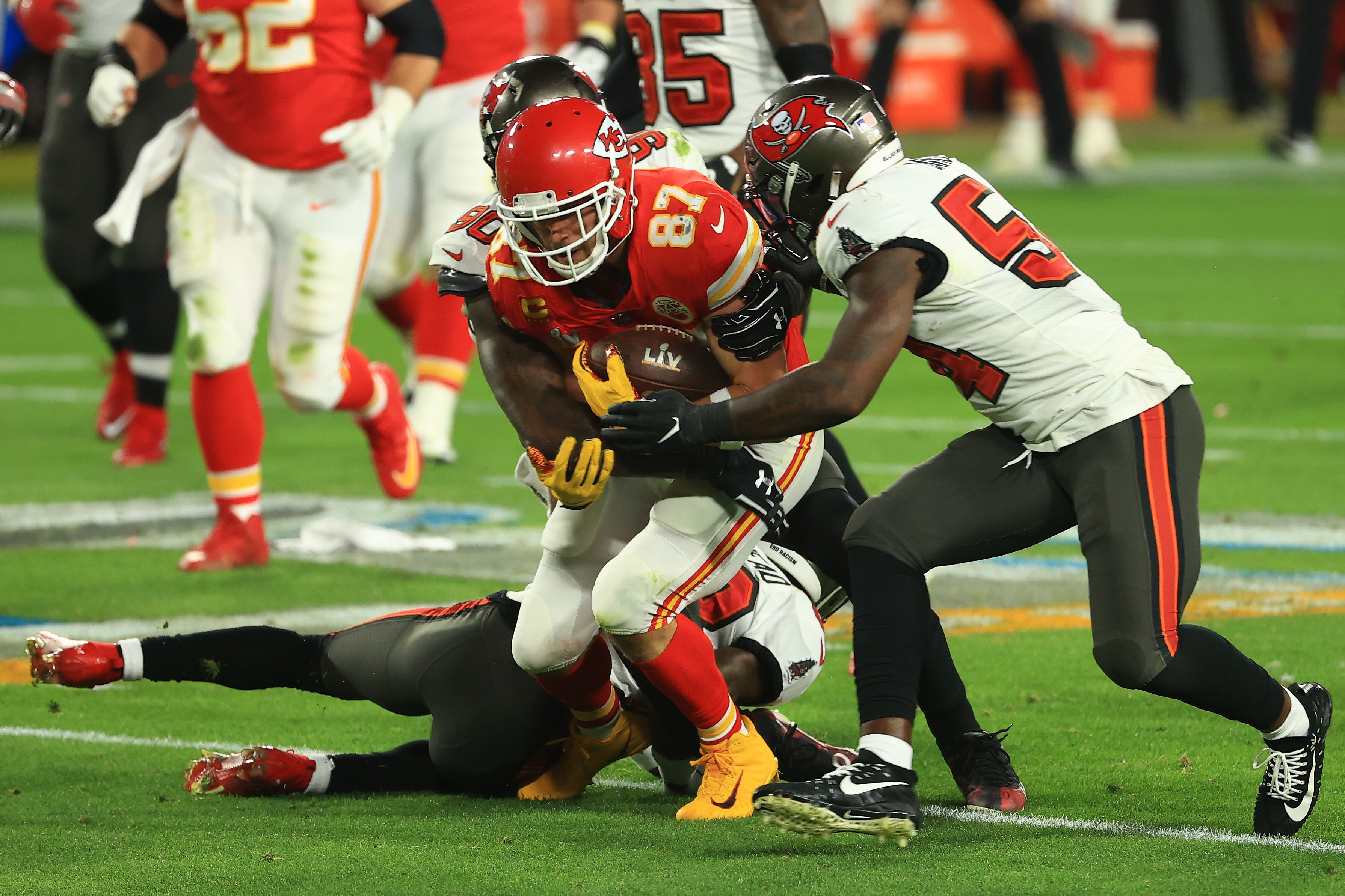 TAMPA, FLORIDA - FEBRUARY 07: Jason Pierre-Paul #90 and Lavonte David #54 of the Tampa Bay Buccaneers tackles Travis Kelce #87 of the Kansas City Chiefs during the second quarter in Super Bowl LV at Raymond James Stadium on February 07, 2021 in Tampa, Florida. (Photo by Mike Ehrmann/Getty Images)