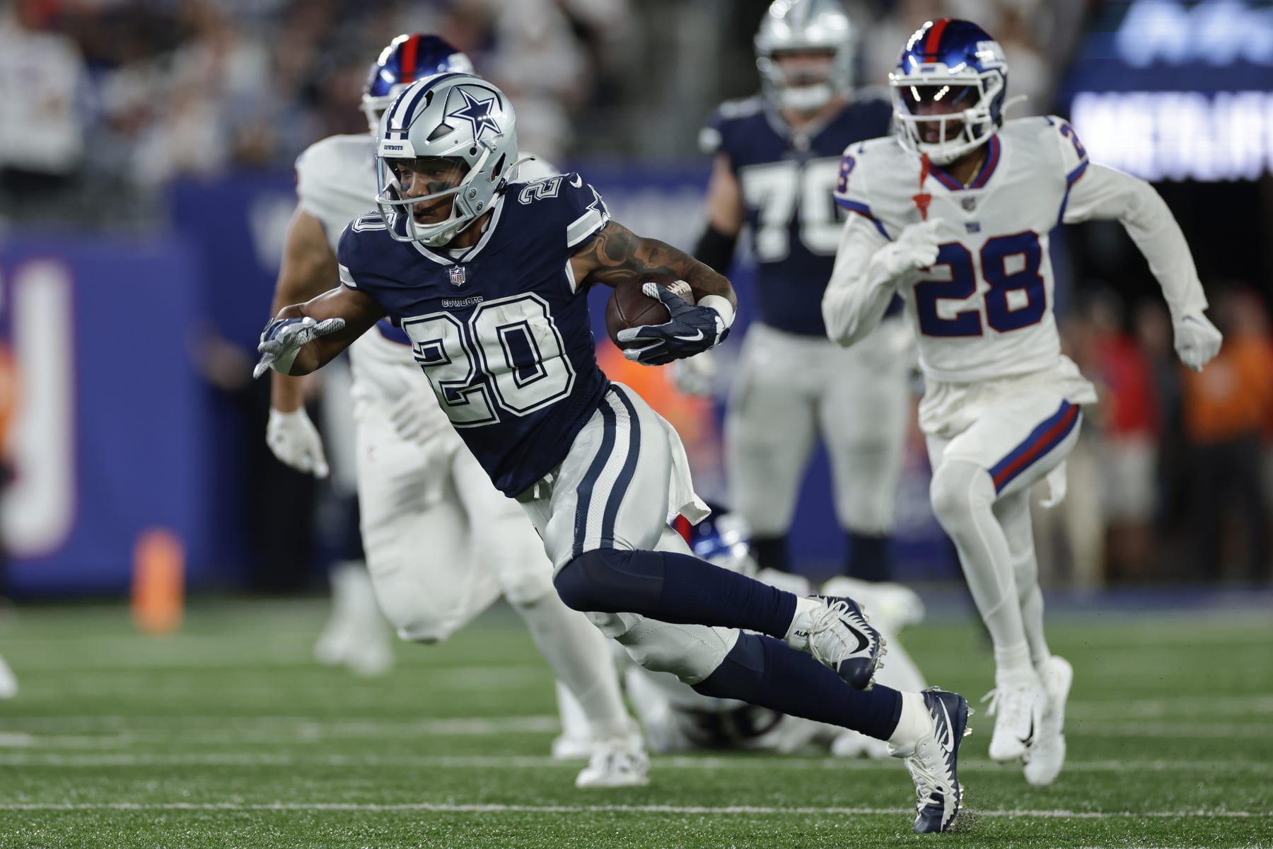Dallas Cowboys running back Tony Pollard (20) runs the ball against the New York Giants during the second quarter of an NFL football game, Monday, Sept. 26, 2022, in East Rutherford, N.J. (AP Photo/Adam Hunger)