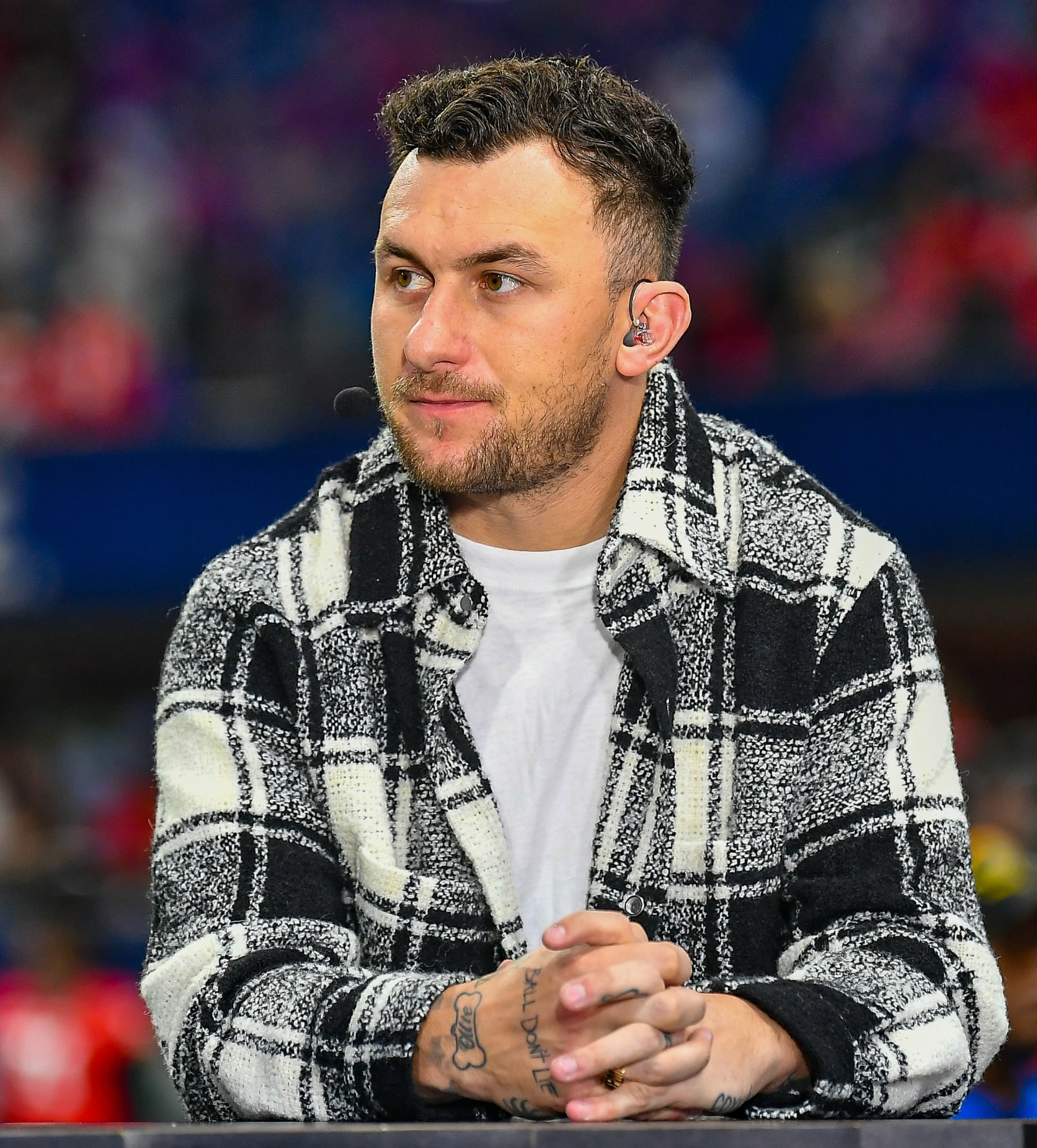ATLANTA, GA - DECEMBER 03:  Former Texas A&M quarterback Johnny Manziel is interviewed prior to the start of the SEC Championship football game between the LSU Tigers and the Georgia Bulldogs on December 3rd, 2022 at Mercedes-Benz Stadium in Atlanta, GA. (Photo by Rich von Biberstein/Icon Sportswire via Getty Images)