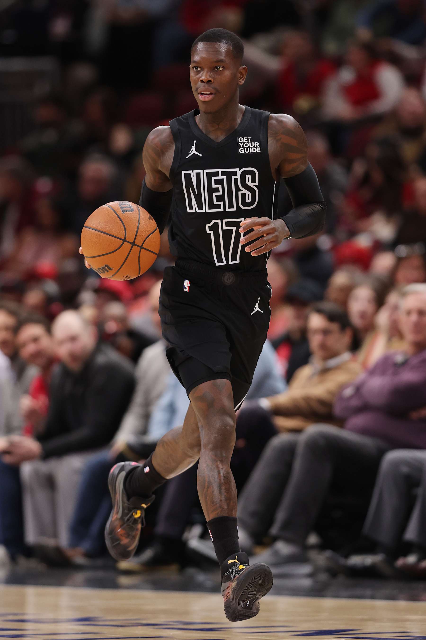 CHICAGO, ILLINOIS - DECEMBER 02: Dennis Schroder #17 of the Brooklyn Nets dribbles against the Chicago Bulls during the first half at the United Center on December 02, 2024 in Chicago, Illinois. NOTE TO USER: User expressly acknowledges and agrees that, by downloading and or using this photograph, User is consenting to the terms and conditions of the Getty Images License Agreement.  (Photo by Michael Reaves/Getty Images)