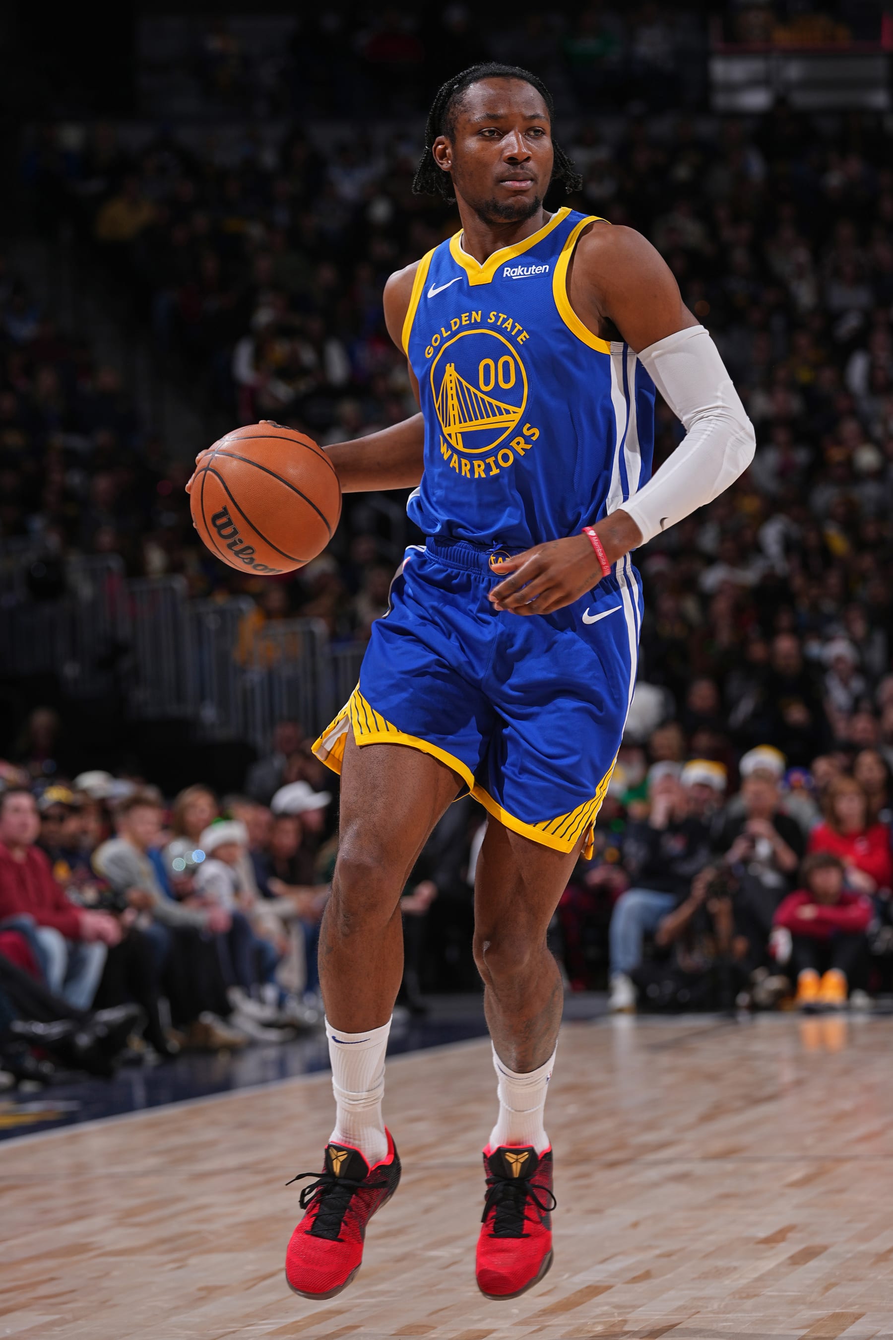 DENVER, CO - DECEMBER 25: Jonathan Kuminga #00 of the Golden State Warriors looks on during the game against the Denver Nuggets on December 25, 2023 at the Ball Arena in Denver, Colorado. NOTE TO USER: User expressly acknowledges and agrees that, by downloading and/or using this Photograph, user is consenting to the terms and conditions of the Getty Images License Agreement. Mandatory Copyright Notice: Copyright 2023 NBAE (Photo by Bart Young/NBAE via Getty Images)