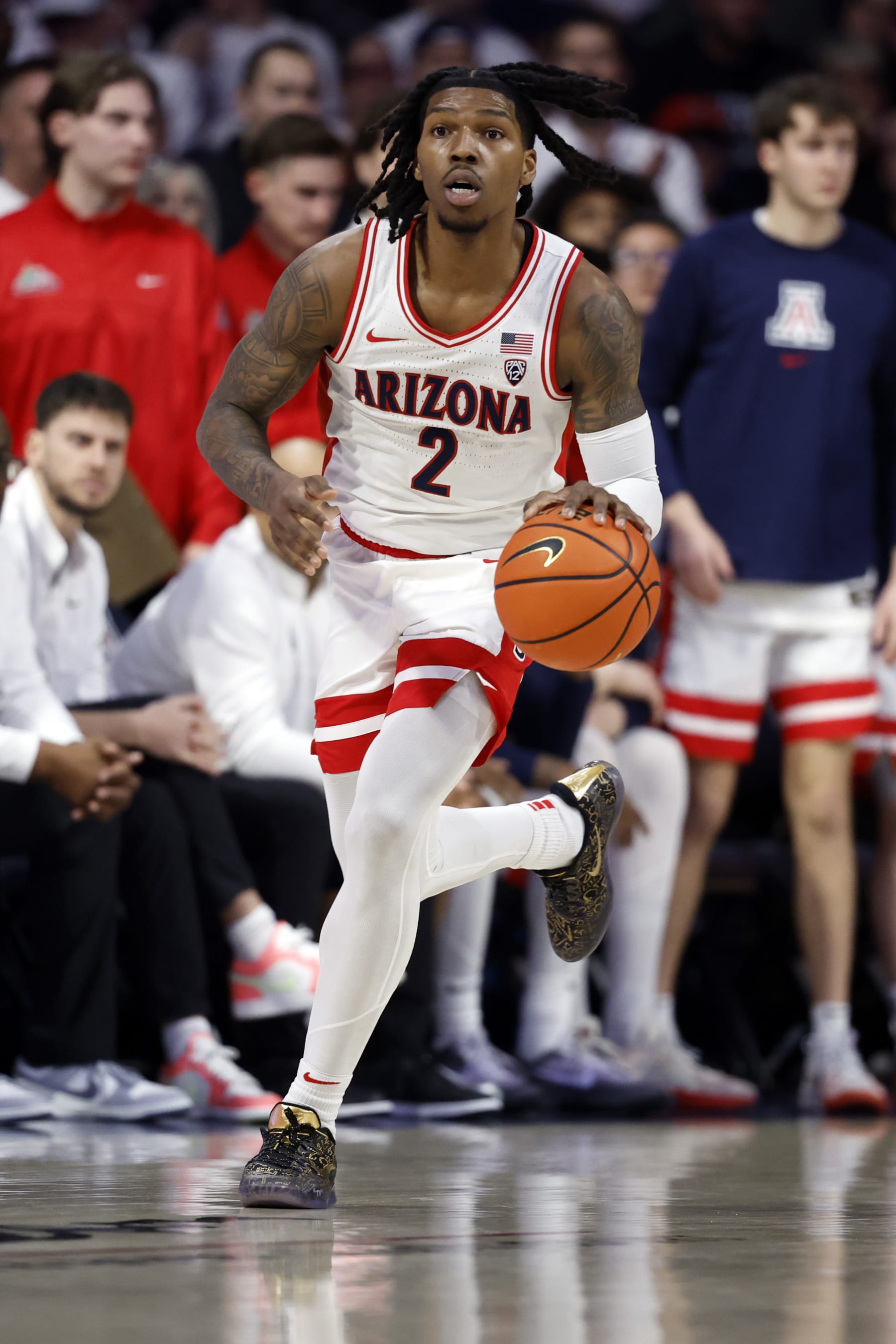 TUCSON, ARIZONA - MARCH 02: Caleb Love #2 of the Arizona Wildcats controls the ball during the game against the Oregon Ducks at McKale Center on March 02, 2024 in Tucson, Arizona. The Wildcats defeated the Ducks 103-83. (Photo by Chris Coduto/Getty Images)