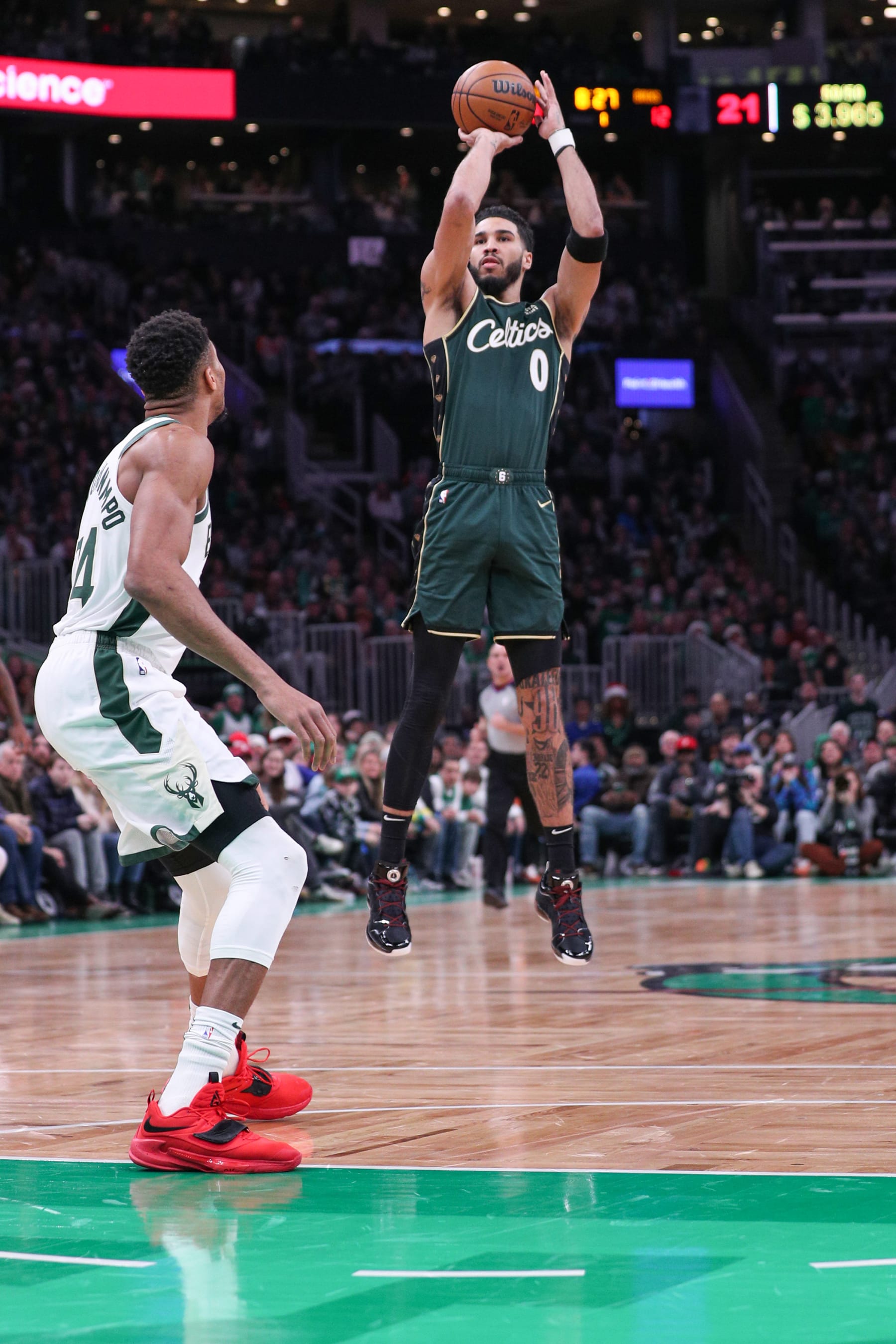 Giannis Antetokounmpo (left), Jayson Tatum (right). 