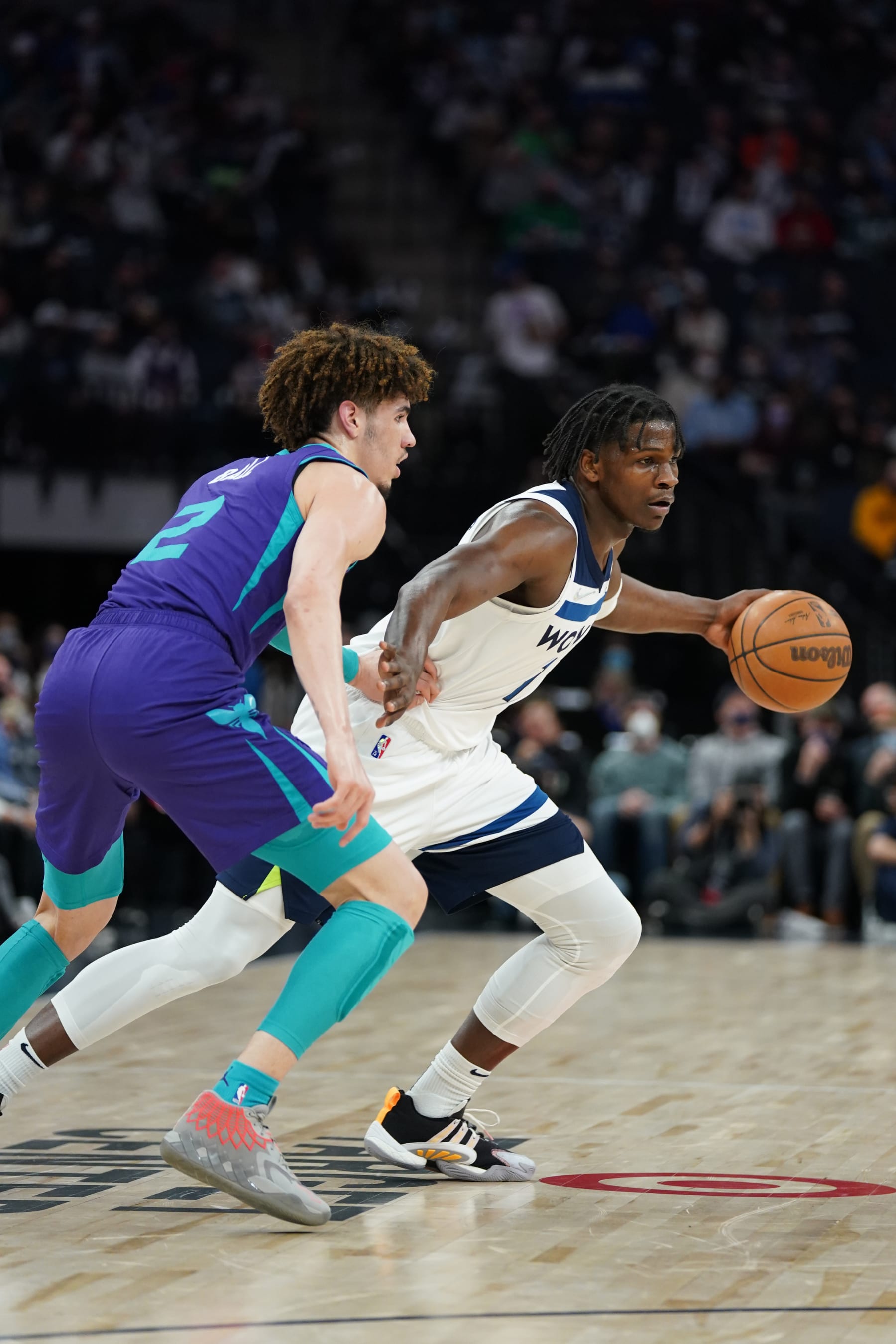 MINNEAPOLIS, MN - FEBRUARY 15: LaMelo Ball #2 of the Charlotte Hornets plays defense on Anthony Edwards #1 of the Minnesota Timberwolves during the game on February 15, 2022 at Target Center in Minneapolis, Minnesota. NOTE TO USER: User expressly acknowledges and agrees that, by downloading and or using this Photograph, user is consenting to the terms and conditions of the Getty Images License Agreement. Mandatory Copyright Notice: Copyright 2022 NBAE (Photo by Jordan Johnson/NBAE via Getty Images)