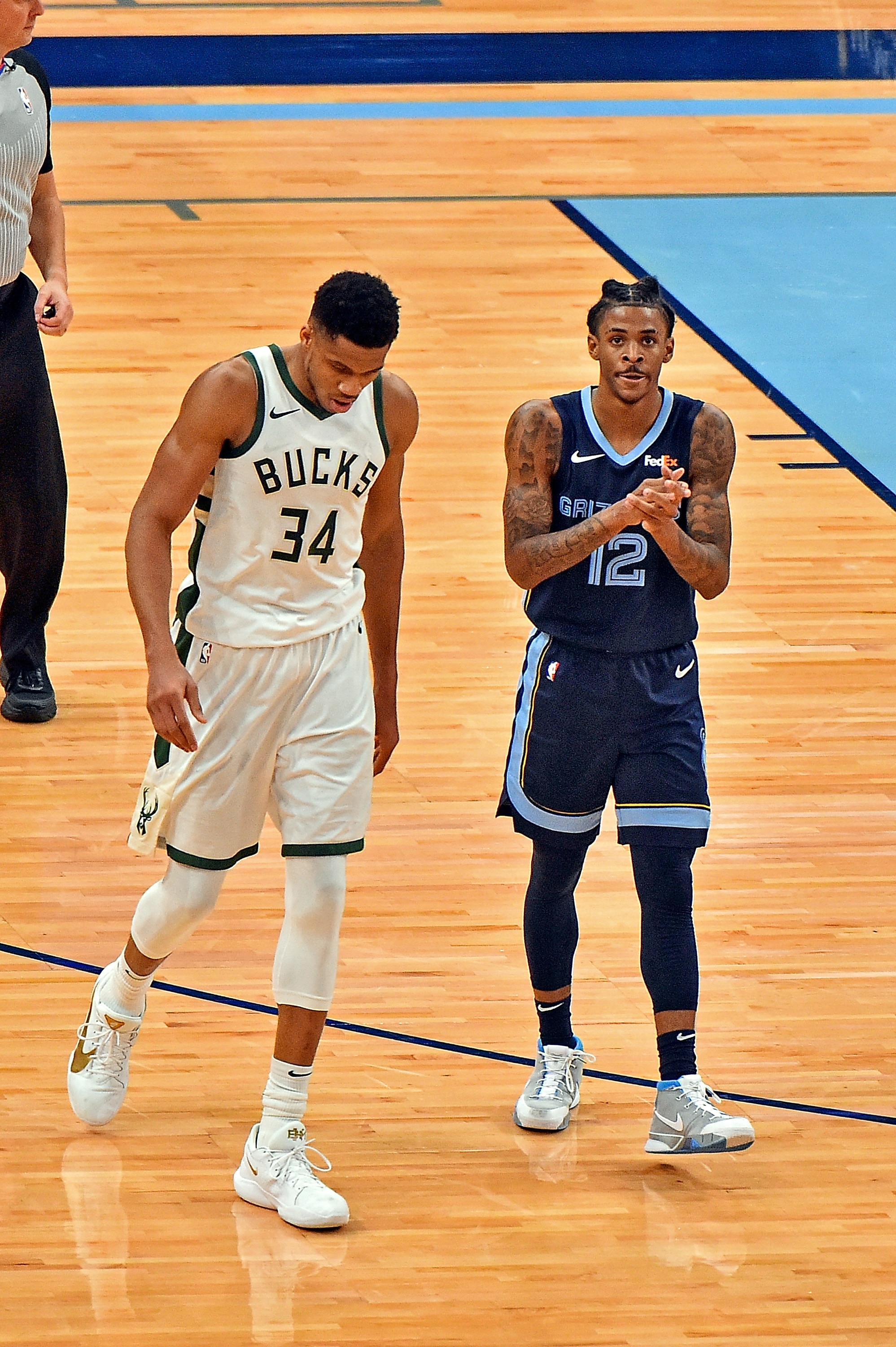 MEMPHIS, TENNESSEE - MARCH 04: Ja Morant #12 of the Memphis Grizzlies and Giannis Antetokounmpo #34 of the Milwaukee Bucks during the game at FedExForum on March 04, 2021 in Memphis, Tennessee. NOTE TO USER: User expressly acknowledges and agrees that, by downloading and or using this photograph, User is consenting to the terms and conditions of the Getty Images License Agreement (Photo by Justin Ford/Getty Images)