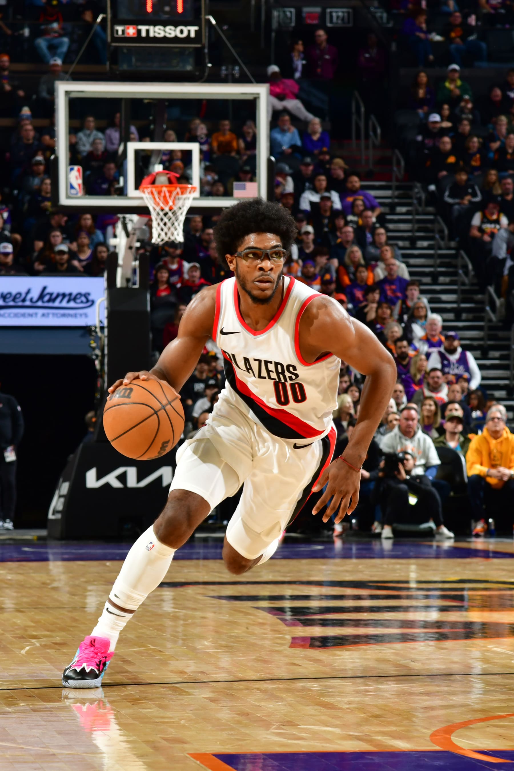 PHOENIX, AZ - JANUARY  1: Scoot Henderson #00 of the Portland Trail Blazers handles the ball during the game against the Phoenix Suns on January 1, 2024 at Footprint Center in Phoenix, Arizona. NOTE TO USER: User expressly acknowledges and agrees that, by downloading and or using this photograph, user is consenting to the terms and conditions of the Getty Images License Agreement. Mandatory Copyright Notice: Copyright 2024 NBAE (Photo by Kate Frese/NBAE via Getty Images)
