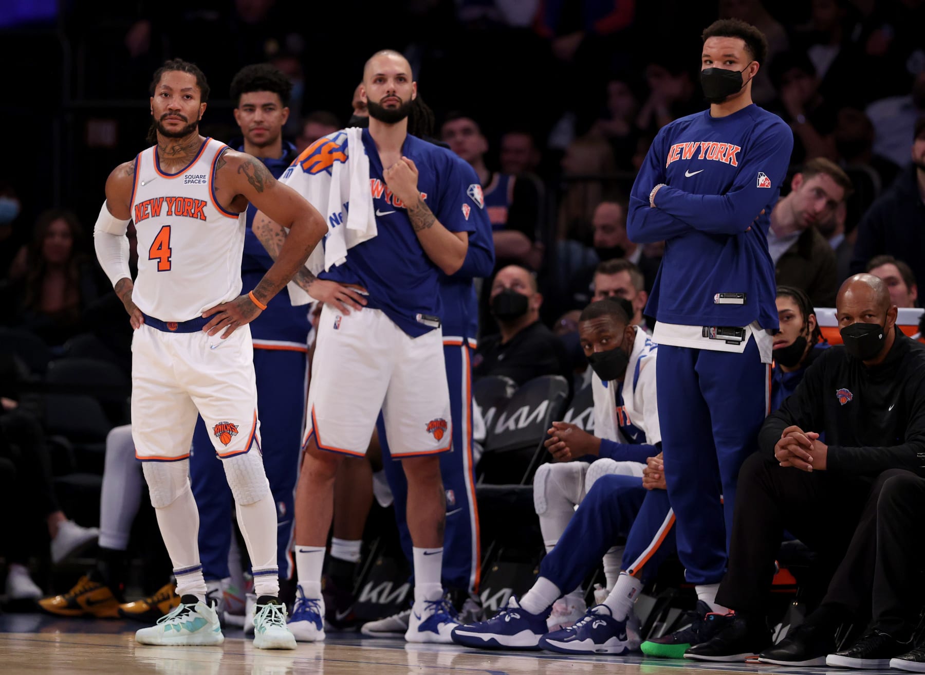 NEW YORK, NEW YORK - NOVEMBER 17:  Derrick Rose #4 of the New York Knicks and teammates on the bench Evan Fournier #13 and Kevin Knox II #20 react to the loss to the Orlando Magic at Madison Square Garden on November 17, 2021 in New York City. The Orlando Magic defeated the New York Knicks 104-98. NOTE TO USER: User expressly acknowledges and agrees that, by downloading and or using this photograph, User is consenting to the terms and conditions of the Getty Images License Agreement. (Photo by Elsa/Getty Images)