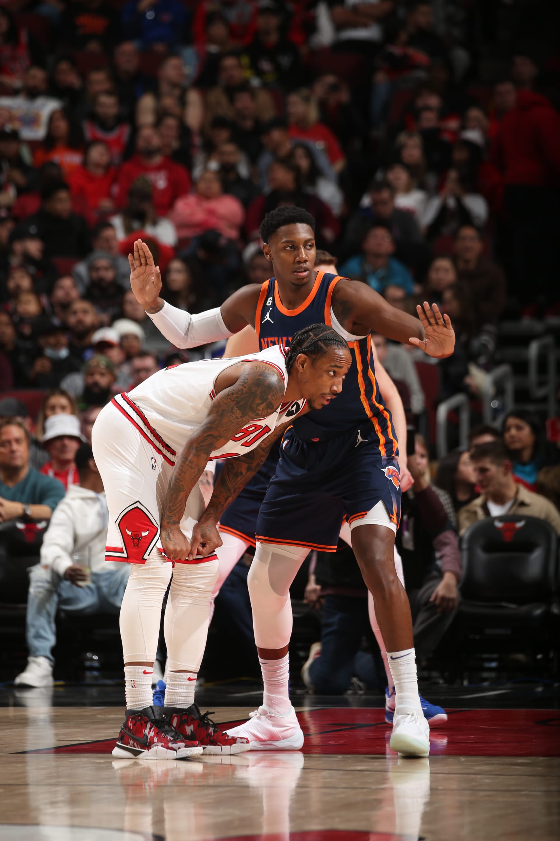 CHICAGO, IL - DECEMBER 14: RJ Barrett #9 of the New York Knicks plays defense on DeMar DeRozan #11 of the Chicago Bulls during the game on December 14, 2022 at United Center in Chicago, Illinois. NOTE TO USER: User expressly acknowledges and agrees that, by downloading and or using this photograph, User is consenting to the terms and conditions of the Getty Images License Agreement. Mandatory Copyright Notice: Copyright 2022 NBAE (Photo by Gary Dineen/NBAE via Getty Images)