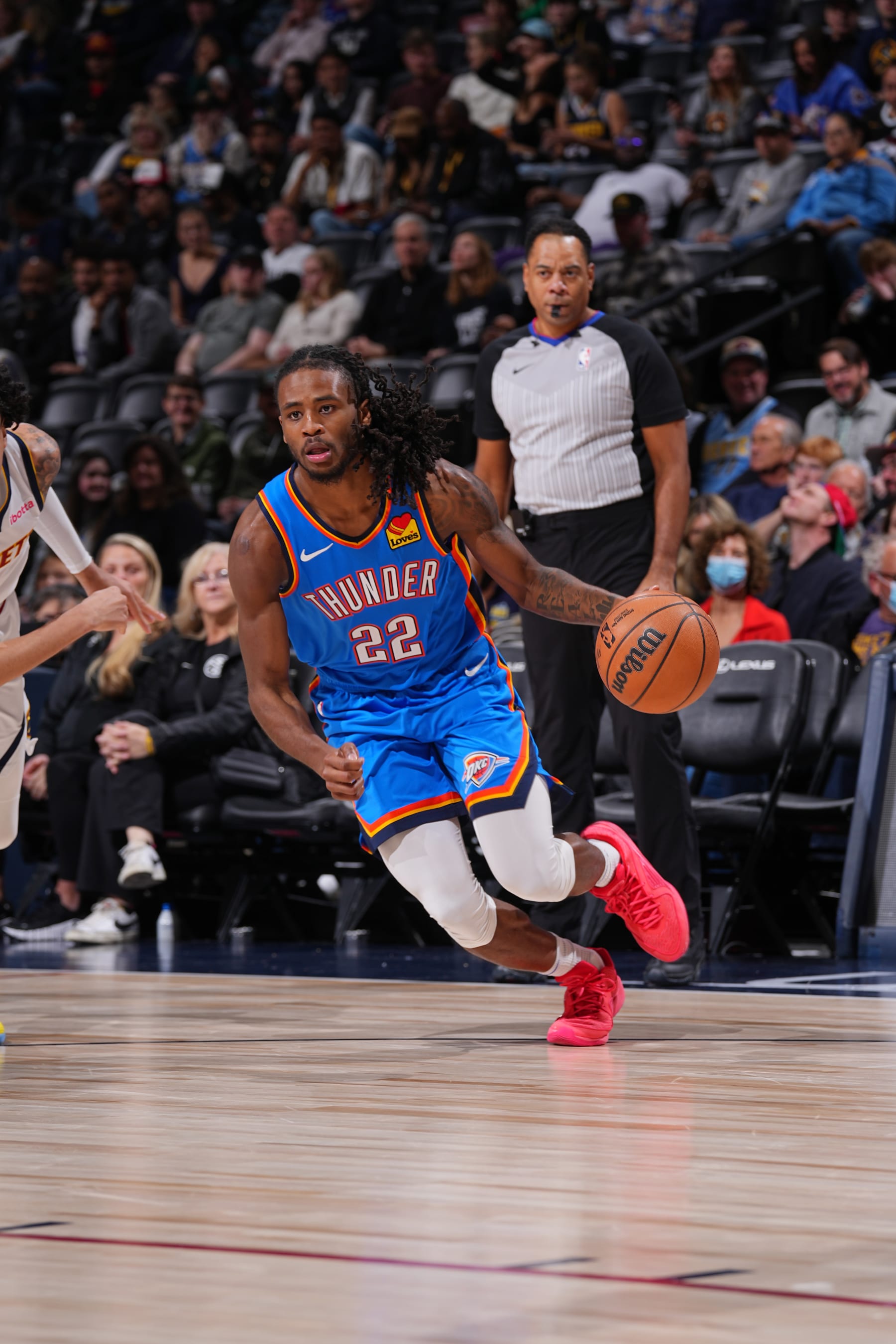 DENVER, CO - DECEMBER 29: Cason Wallace #22 of the Oklahoma City Thunder dribbles the ball during the game against the Denver Nuggets on December 29, 2023 at the Ball Arena in Denver, Colorado. NOTE TO USER: User expressly acknowledges and agrees that, by downloading and/or using this Photograph, user is consenting to the terms and conditions of the Getty Images License Agreement. Mandatory Copyright Notice: Copyright 2023 NBAE (Photo by Bart Young/NBAE via Getty Images)
