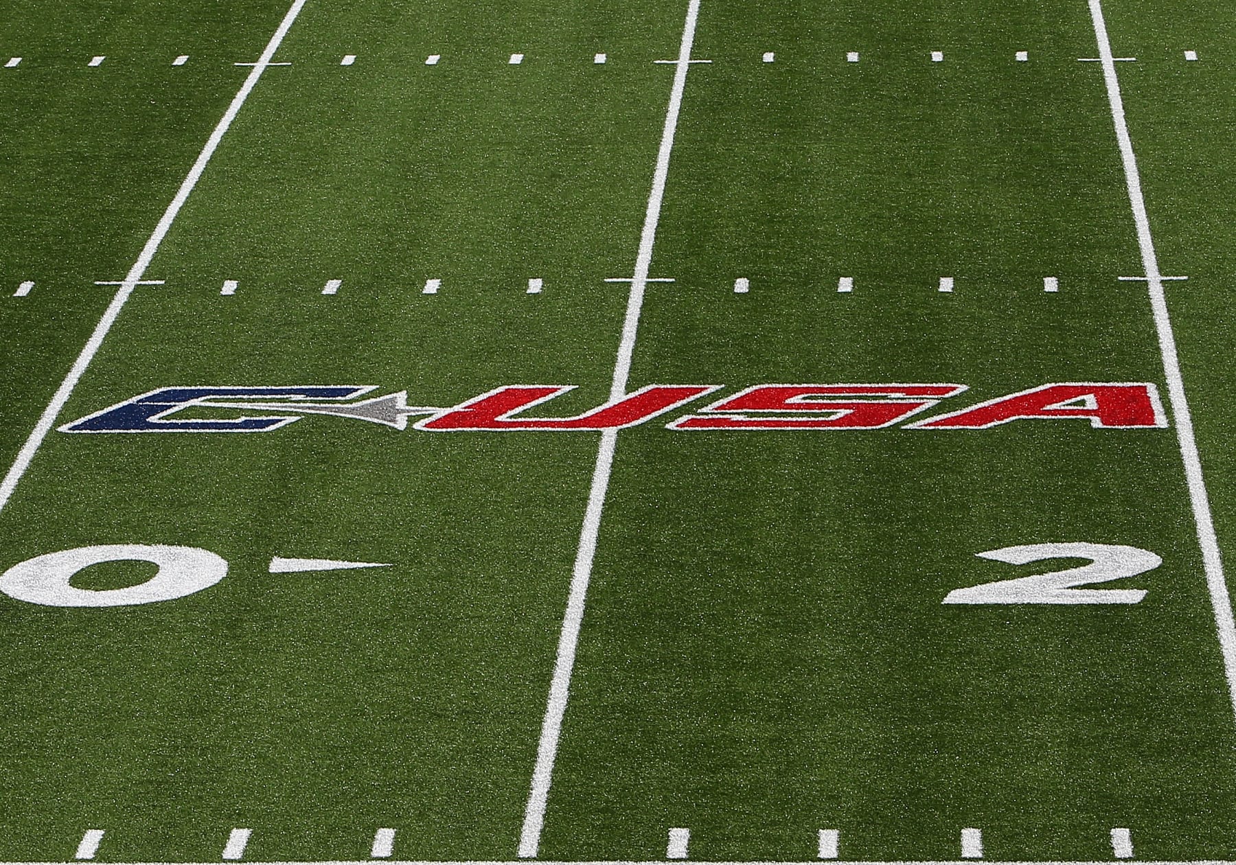 LYNCHBURG, VA - OCTOBER 22: Liberty Flames C-USA logo painted on the field prior to a college football game between the BYU Cougars and the Liberty Flames on October 22, 2022, at Williams Stadium in Lynchburg, VA. (Photo by Lee Coleman/Icon Sportswire via Getty Images)