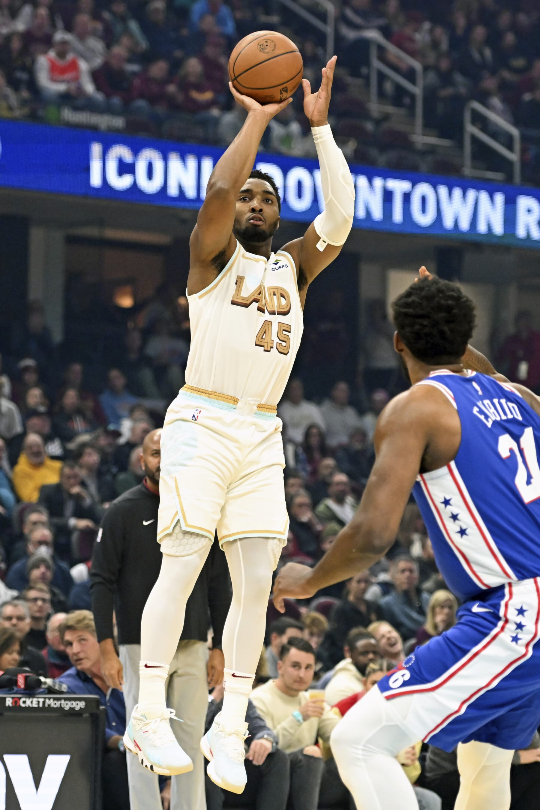 Cleveland Cavaliers guard Donovan Mitchell shoots a three-point basket during the first half of an NBA basketball game against the Philadelphia 76ers, Wednesday, Nov. 30, 2022, in Cleveland. (AP Photo/Nick Cammett)