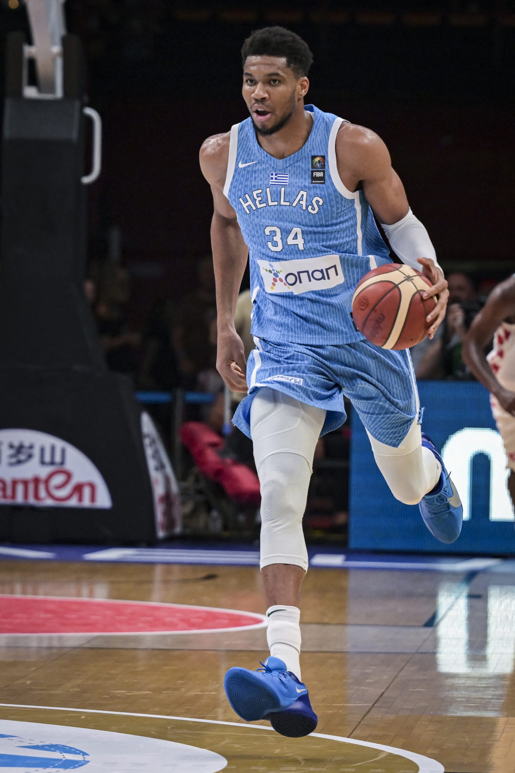 Greece's Giannis Antetokounmpo dribbles the ball during the 2024 FIBA Olympic Qualifying Tournament semi-final basketball match between Greece and Croatia at the Peace and Friendship Stadium in Athens, on July 7, 2024. (Photo by Aris MESSINIS / AFP) (Photo by ARIS MESSINIS/AFP via Getty Images)