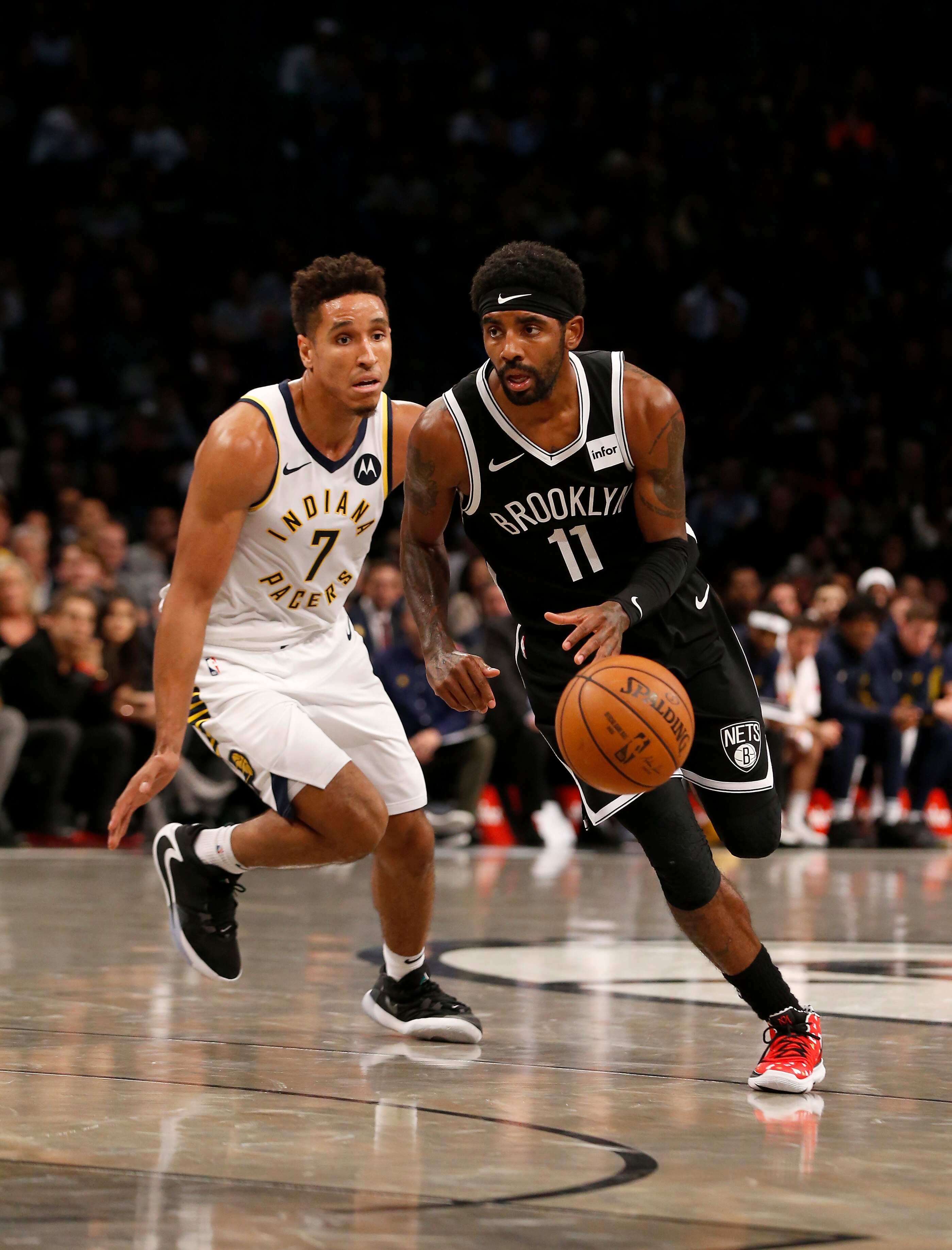 NEW YORK, NEW YORK - OCTOBER 30:  (NEW YORK DAILIES OUT)  Kyrie Irving #11 of the Brooklyn Nets in action against Malcolm Brogdon #7 of the Indiana Pacers at Barclays Center on October 30, 2019 in New York City.  The Pacers defeated the Nets 118-108. NOTE TO USER: User expressly acknowledges and agrees that , by downloading and or using this photograph, user is consenting to the terms and conditions of the Getty Images License Agreement.  (Photo by Jim McIsaac/Getty Images)