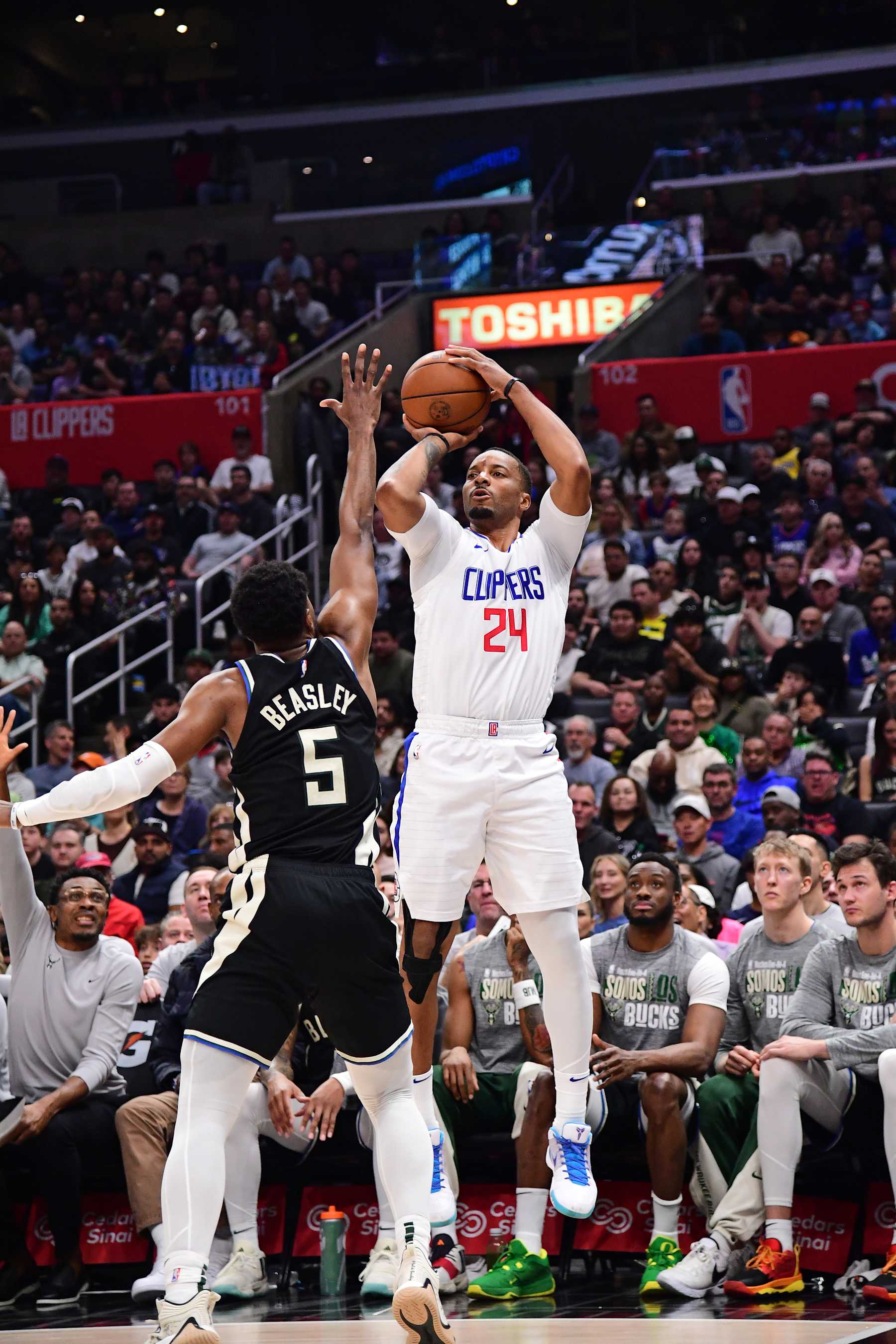 LOS ANGELES, CA - MARCH 10: Norman Powell #24 of the LA Clippers shoots a three point basket during the game against the Milwaukee Bucks on March 10, 2024 at Crypto.Com Arena in Los Angeles, California. NOTE TO USER: User expressly acknowledges and agrees that, by downloading and/or using this Photograph, user is consenting to the terms and conditions of the Getty Images License Agreement. Mandatory Copyright Notice: Copyright 2024 NBAE (Photo by Adam Pantozzi/NBAE via Getty Images)