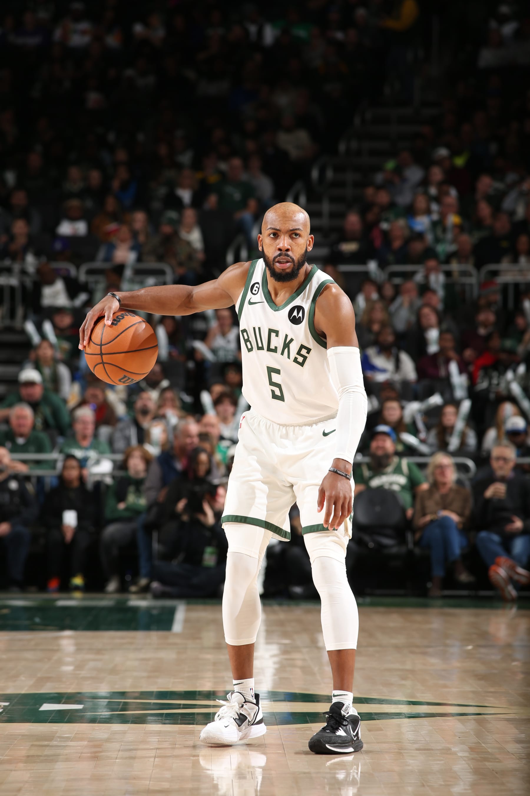MILWAUKEE, WI - NOVEMBER 14: Jevon Carter #5 of the Milwaukee Bucks handles the ball during the game against the Atlanta Hawks on November 14, 2022 at the Fiserv Forum Center in Milwaukee, Wisconsin. NOTE TO USER: User expressly acknowledges and agrees that, by downloading and or using this Photograph, user is consenting to the terms and conditions of the Getty Images License Agreement. Mandatory Copyright Notice: Copyright 2022 NBAE (Photo by Gary Dineen/NBAE via Getty Images).