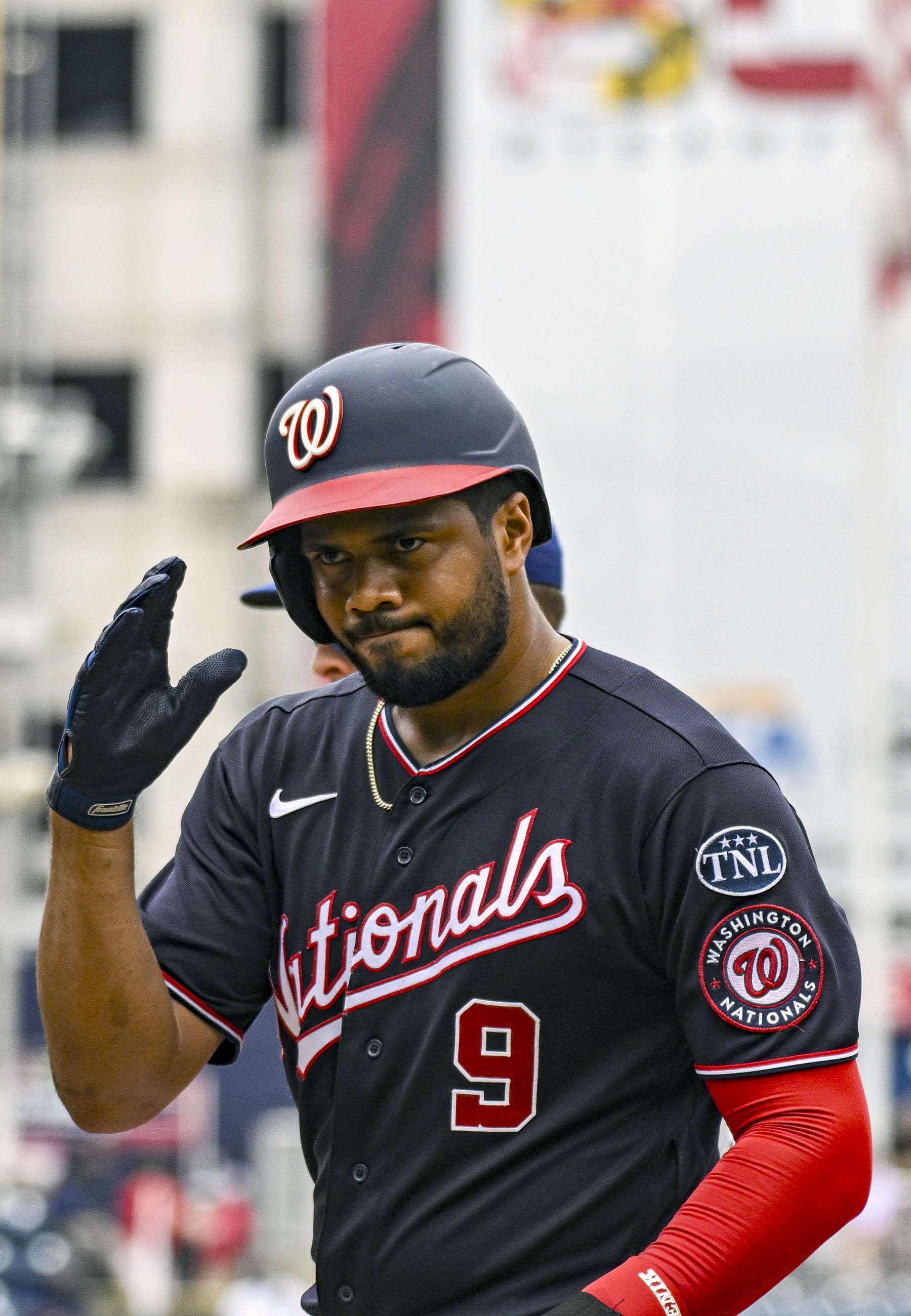 WASHINGTON, DC - July 09: Washington Nationals third baseman Jeimer Candelario (9) acknowledges the bench after his hit during the Texas Rangers versus the Washington Nationals on July 9, 2023 at Nationals Park in Washington, D.C.  (Photo by Mark Goldman/Icon Sportswire via Getty Images)