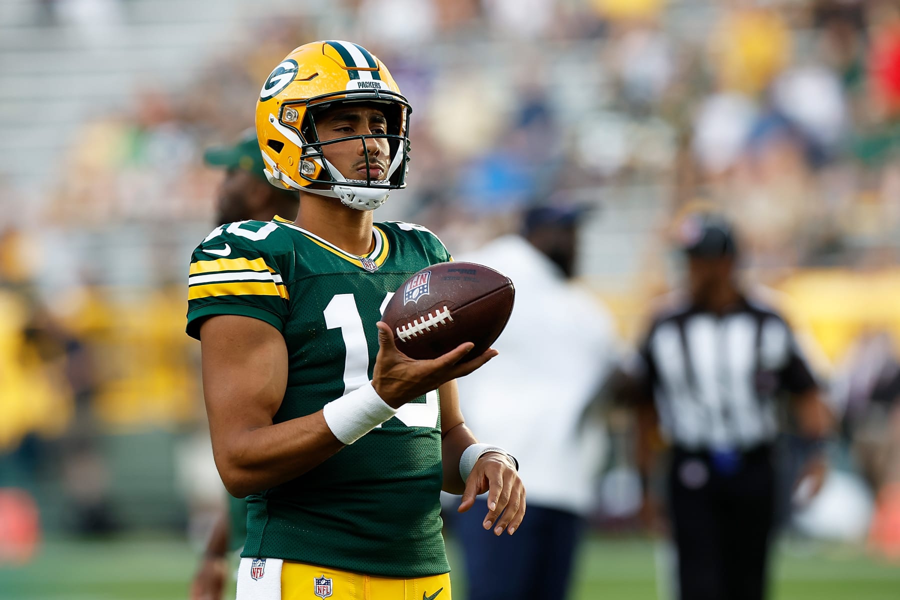 GREEN BAY, WISCONSIN - AUGUST 19: Jordan Love #10 of the Green Bay Packers warms up before the game against the New England Patriots during a preseason game at Lambeau Field on August 19, 2023 in Green Bay, Wisconsin. (Photo by John Fisher/Getty Images)