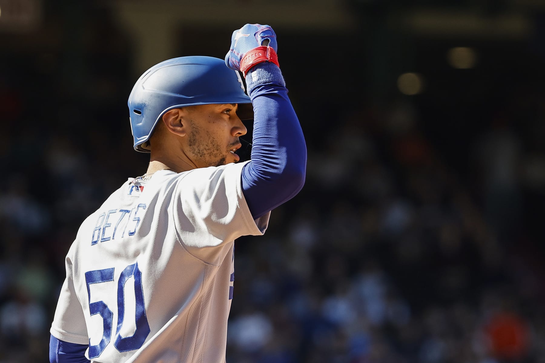 BOSTON, MA - AUGUST 27: Mookie Betts #50 of the Los Angeles Dodgers celebrates towards his bullpen after his RBI single against the Boston Red Sox during the eighth inning at Fenway Park on August 27, 2023 in Boston, Massachusetts. (Photo By Winslow Townson/Getty Images)