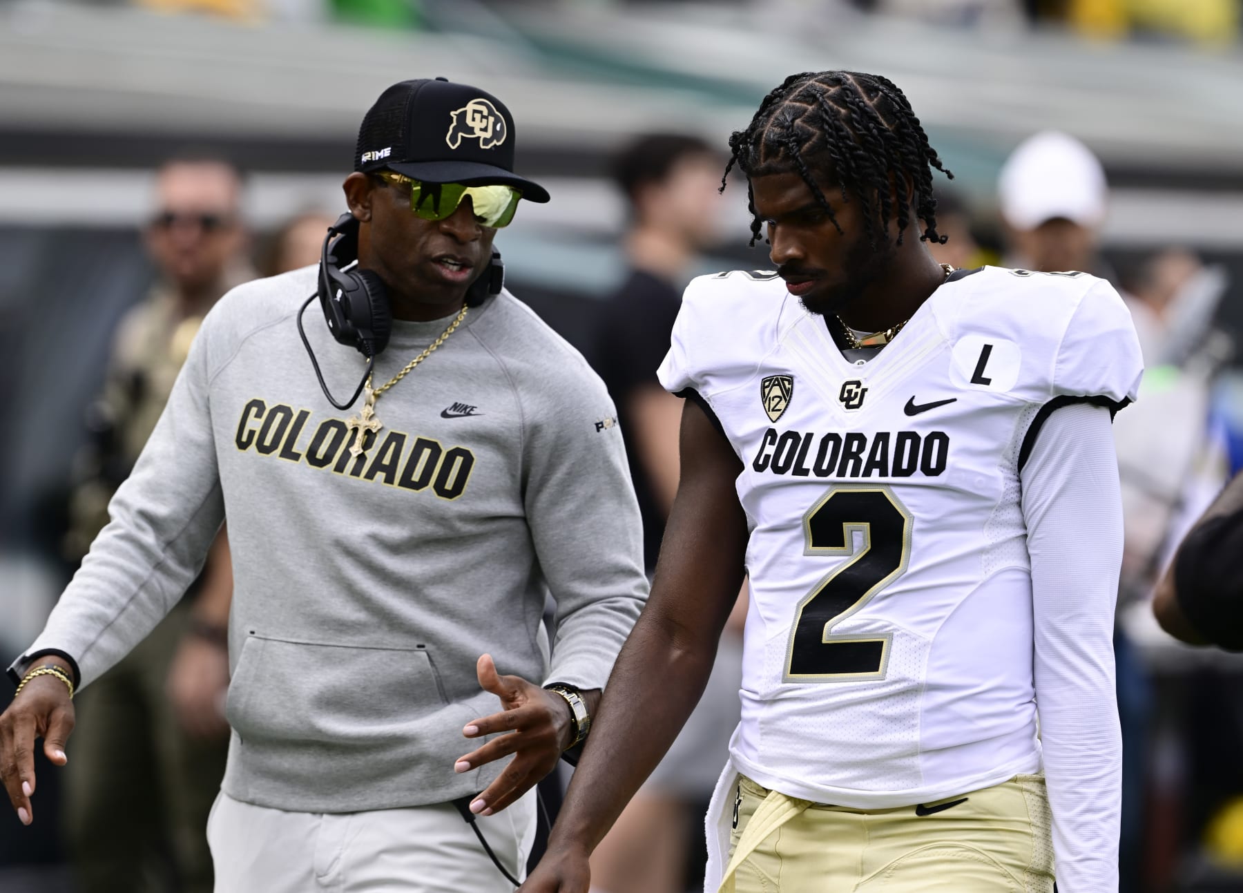 EUGENE, OR - SEPTEMBER 23: Colorado Buffaloes head coach Deion Sanders talks with his son QB Shedeur Sanders before the game against the Oregon Ducks at Autzen Stadium September 23, 2023. (Photo by Andy Cross/MediaNews Group/The Denver Post via Getty Images)