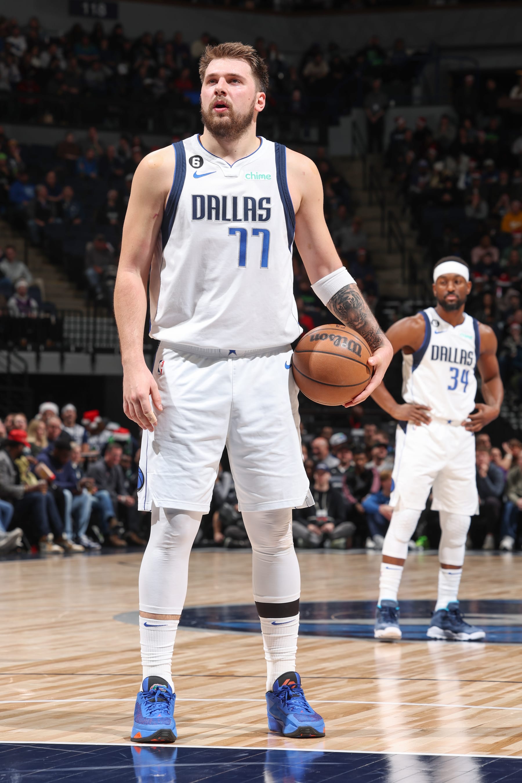 MINNEAPOLIS, MN -  DECEMBER 21: Luka Doncic #77 of the Dallas Mavericks shoots free throw during the game against the Minnesota Timberwolves on December 21, 2022 at Target Center in Minneapolis, Minnesota. NOTE TO USER: User expressly acknowledges and agrees that, by downloading and or using this Photograph, user is consenting to the terms and conditions of the Getty Images License Agreement. Mandatory Copyright Notice: Copyright 2022 NBAE (Photo by David Sherman/NBAE via Getty Images)