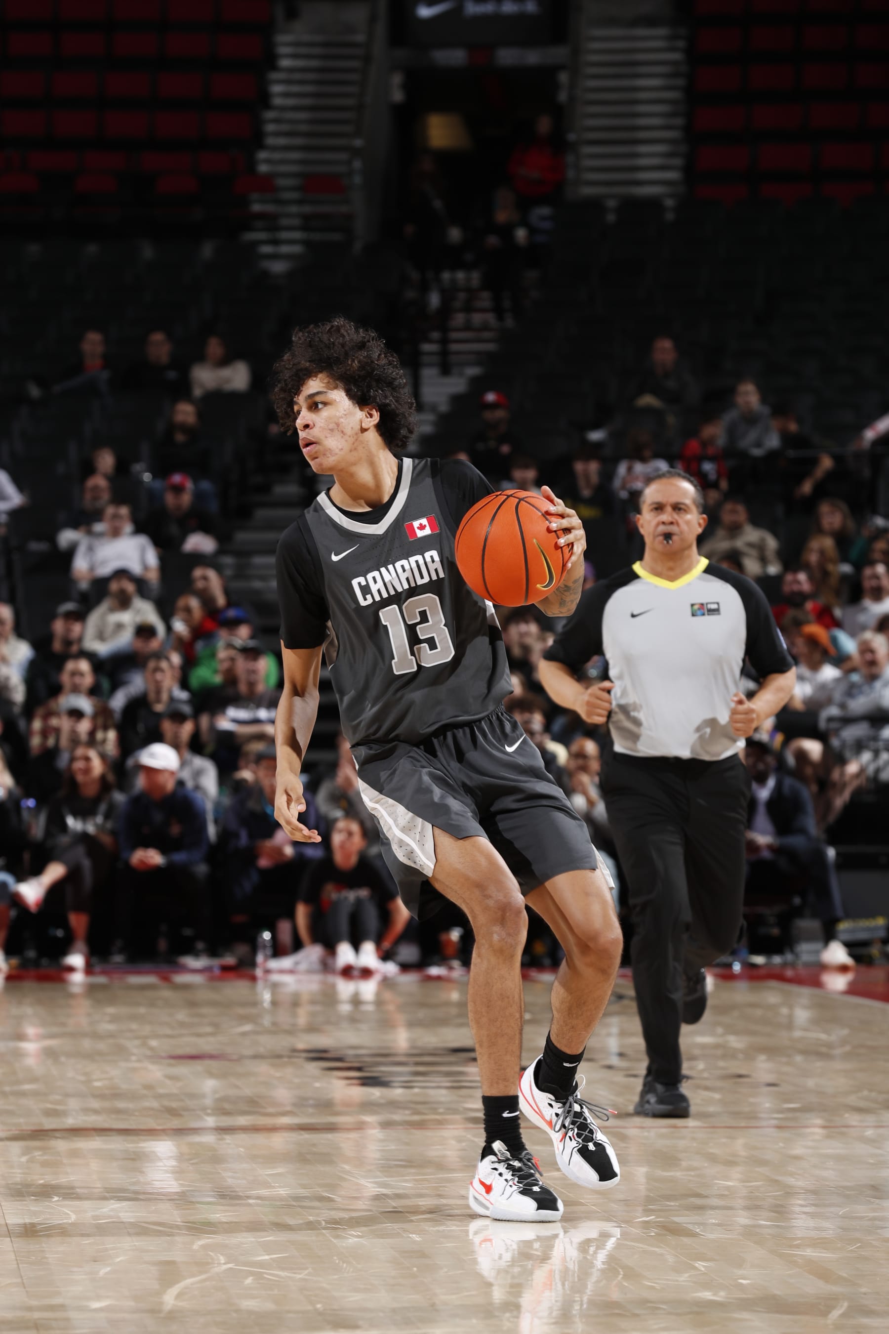 PORTLAND, OR - APRIL 13: Will Riley #13 of Team World dribbles the ball during the game against Team USA during the 2024 Nike Hoop Summit on April 13, 2024 at the Moda Center Arena in Portland, Oregon. NOTE TO USER: User expressly acknowledges and agrees that, by downloading and or using this photograph, user is consenting to the terms and conditions of the Getty Images License Agreement. Mandatory Copyright Notice: Copyright 2024 NBAE (Photo by Cameron Browne/NBAE via Getty Images)