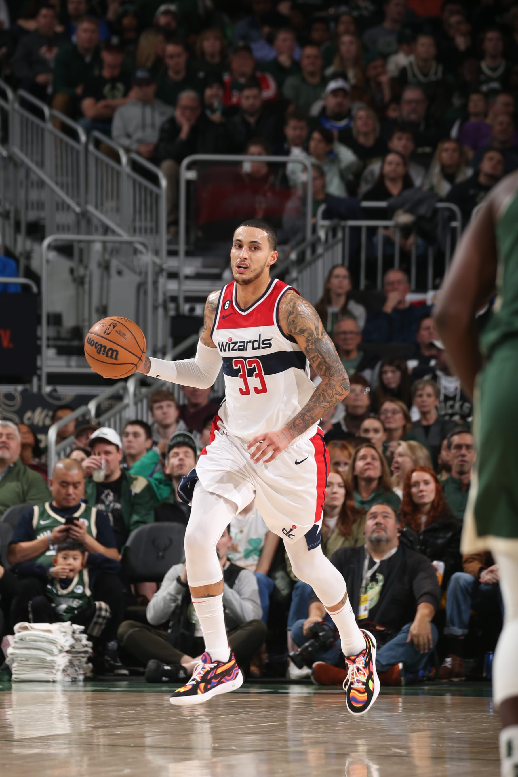 MILWAUKEE, WI - JANUARY 3: Kyle Kuzma #33 of the Washington Wizards dribbles the ball during the game against the Milwaukee Bucks on January 3, 2023 at the Fiserv Forum Center in Milwaukee, Wisconsin. NOTE TO USER: User expressly acknowledges and agrees that, by downloading and or using this Photograph, user is consenting to the terms and conditions of the Getty Images License Agreement. Mandatory Copyright Notice: Copyright 2023 NBAE (Photo by Gary Dineen/NBAE via Getty Images).