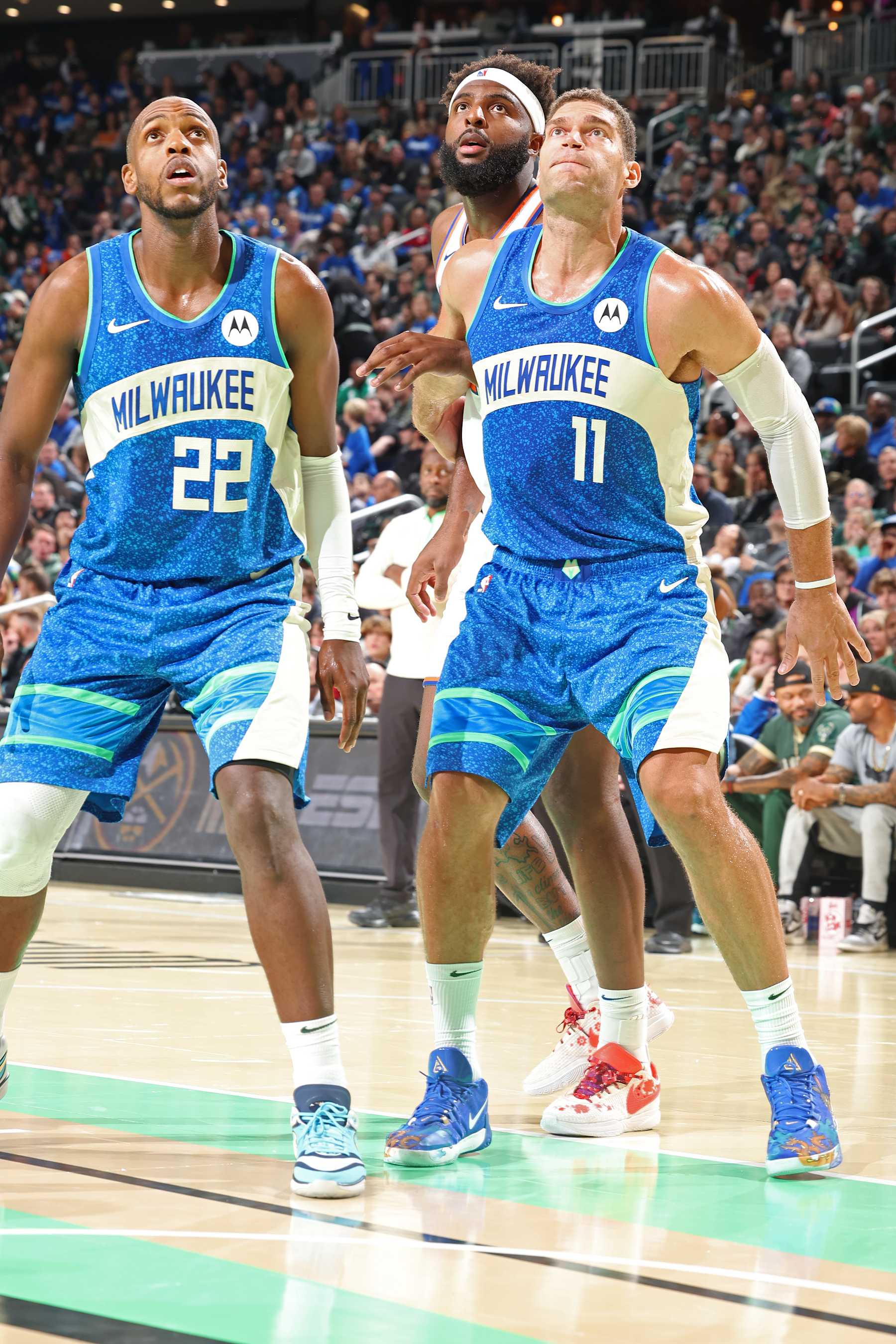 MILWAUKEE, WI -  NOVEMBER 3: Khris Middleton #22 and Brook Lopez #11 of the Milwaukee Bucks box out during the game against the New York Knicks on November 3, 2023 at Fiserv Forum in Milwaukee, Wisconsin. NOTE TO USER: User expressly acknowledges and agrees that, by downloading and or using this Photograph, user is consenting to the terms and conditions of the Getty Images License Agreement. Mandatory Copyright Notice: Copyright 2023 NBAE (Photo by David Sherman/NBAE via Getty Images)
