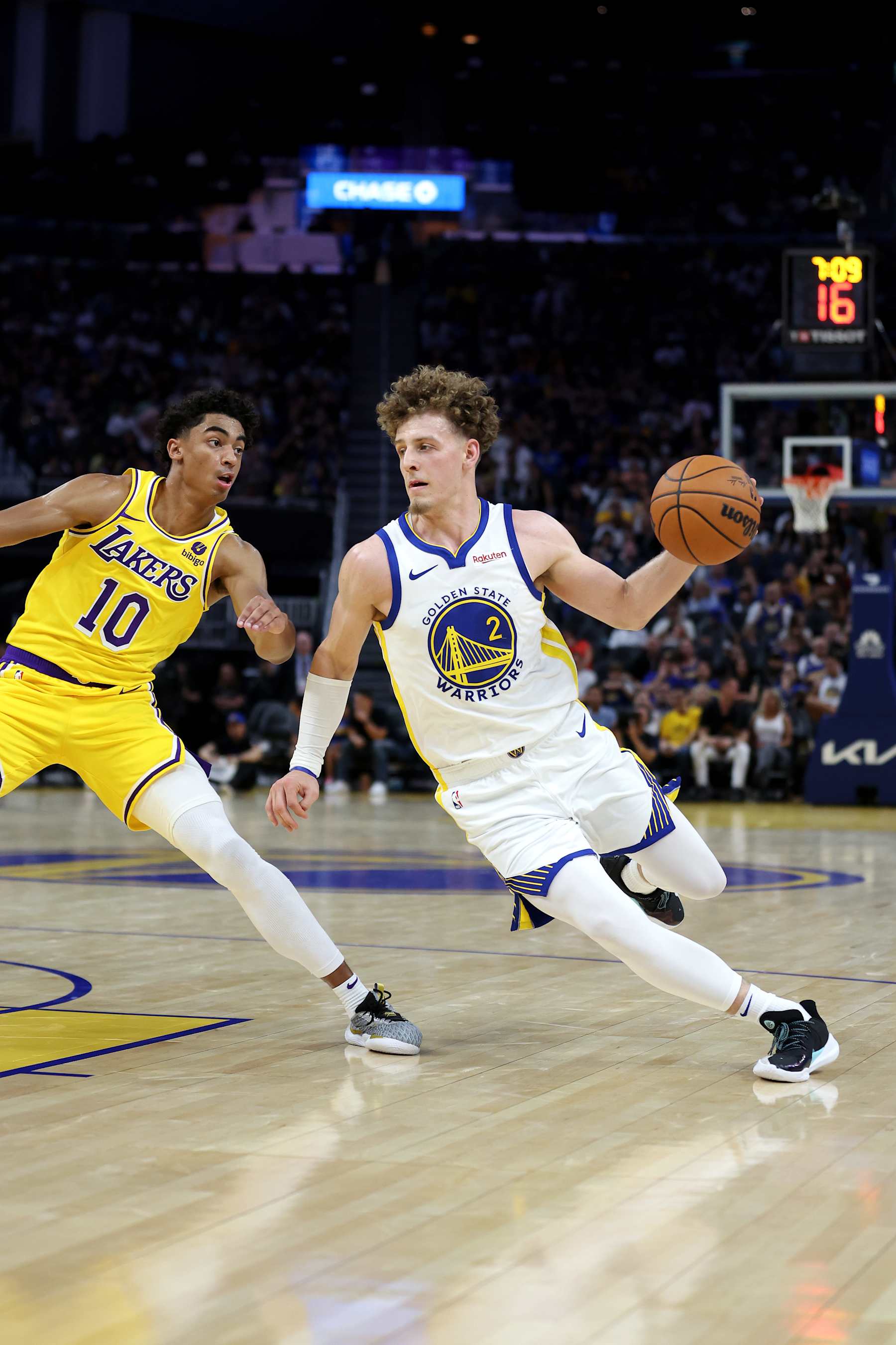 SAN FRANCISCO, CALIFORNIA - OCTOBER 07: Brandin Podziemski #2 of the Golden State Warriors is guarded by Max Christie #10 of the Los Angeles Lakers at Chase Center on October 07, 2023 in San Francisco, California. NOTE TO USER: User expressly acknowledges and agrees that, by downloading and/or using this photograph, user is consenting to the terms and conditions of the Getty Images License Agreement. (Photo by Ezra Shaw/Getty Images)