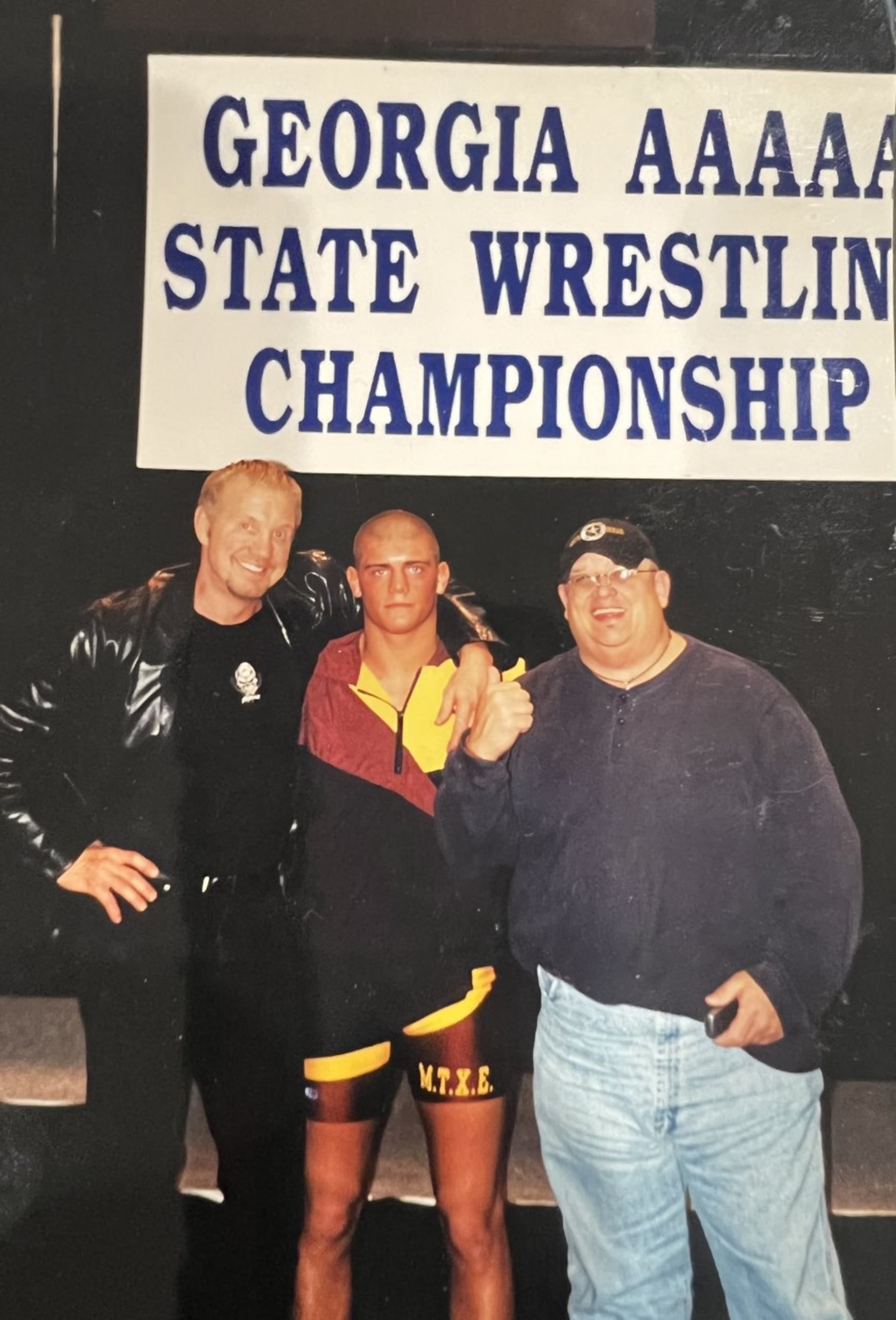 Diamond Dallas Page, Cody and Dusty Rhodes during the Georgia State Wrestling Championship.