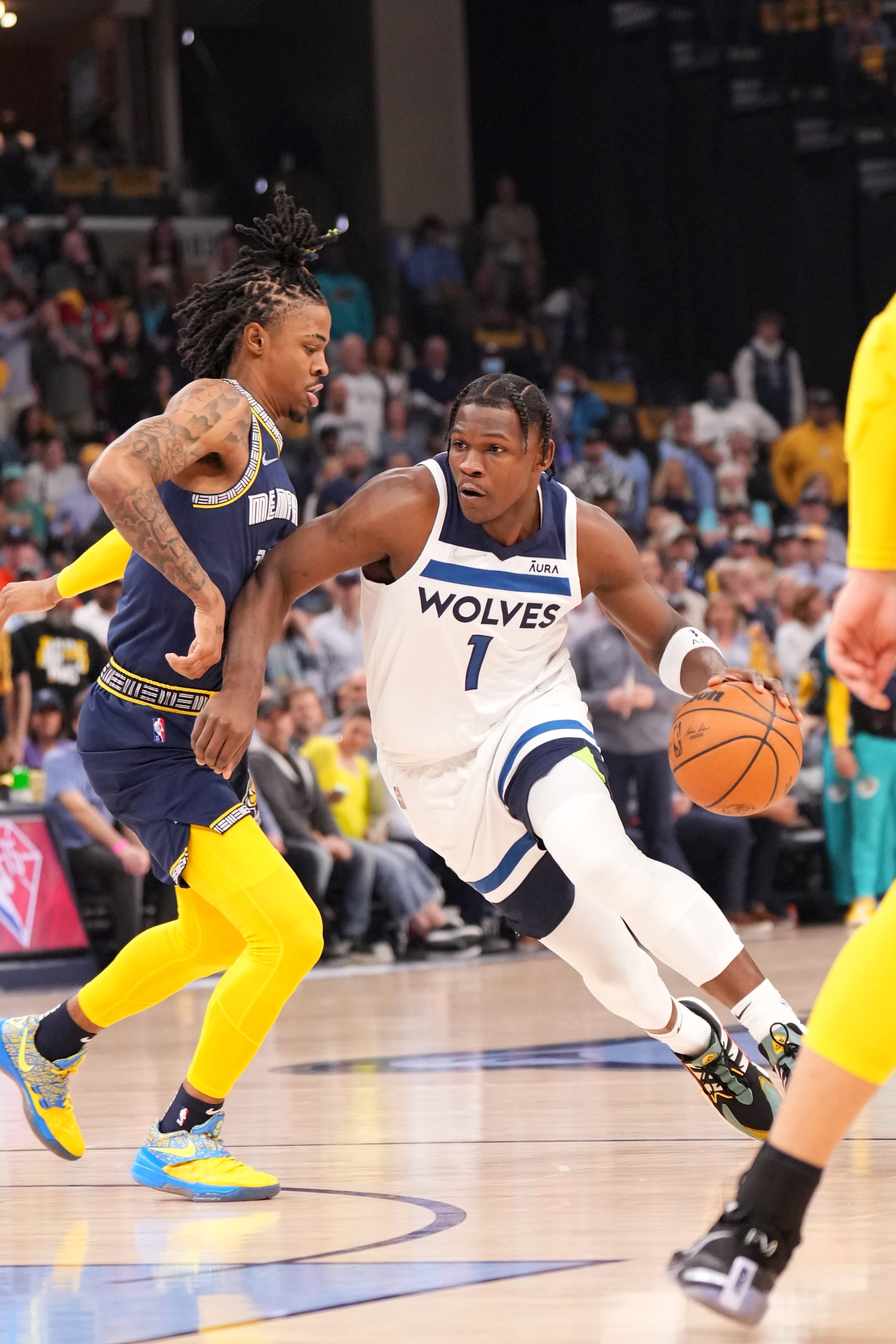 MEMPHIS, TN - APRIL 26: Anthony Edwards #1 of the Minnesota Timberwolves handles the ball against Ja Morant #12 of the Memphis Grizzlies during Round 1 Game 5 on April 26, 2022 at FedExForum in Memphis, Tennessee. NOTE TO USER: User expressly acknowledges and agrees that, by downloading and/or using this Photograph, user is consenting to the terms and conditions of the Getty Images License Agreement. Mandatory Copyright Notice: Copyright 2022 NBAE (Photo by Jesse D. Garrabrant/NBAE via Getty Images)
