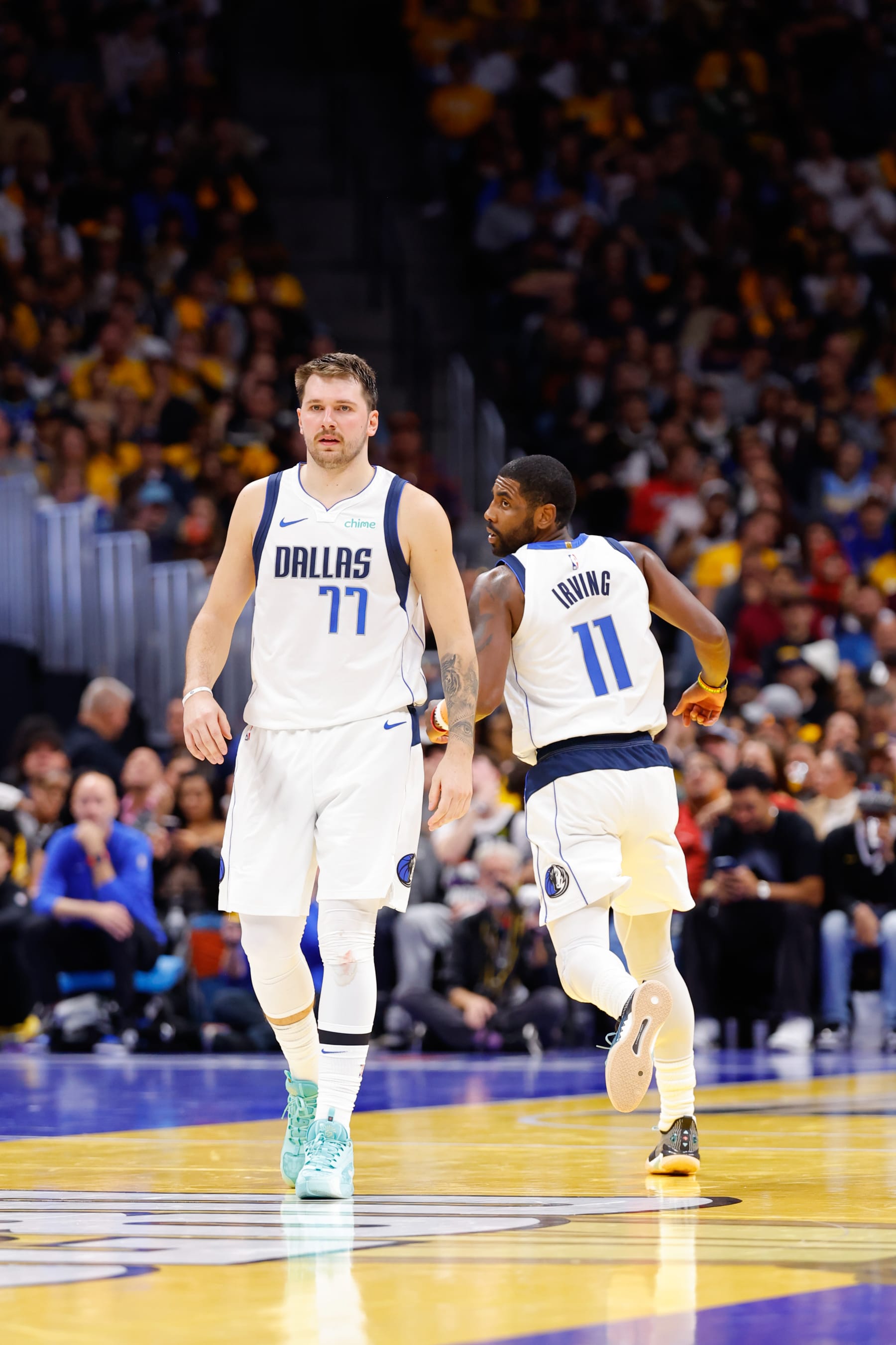 DENVER, COLORADO - NOVEMBER 3: Luka Doncic #77 of the Dallas Mavericks and Kyrie Irving #11 of the Dallas Mavericks looks on against the Denver Nuggets during the NBA In-Season Tournament at Ball Arena on November 3, 2023 in Denver, Colorado. NOTE TO USER: User expressly acknowledges and agrees that, by downloading and or using this photograph, User is consenting to the terms and conditions of the Getty Images License Agreement. (Photo by C. Morgan Engel/Getty Images)