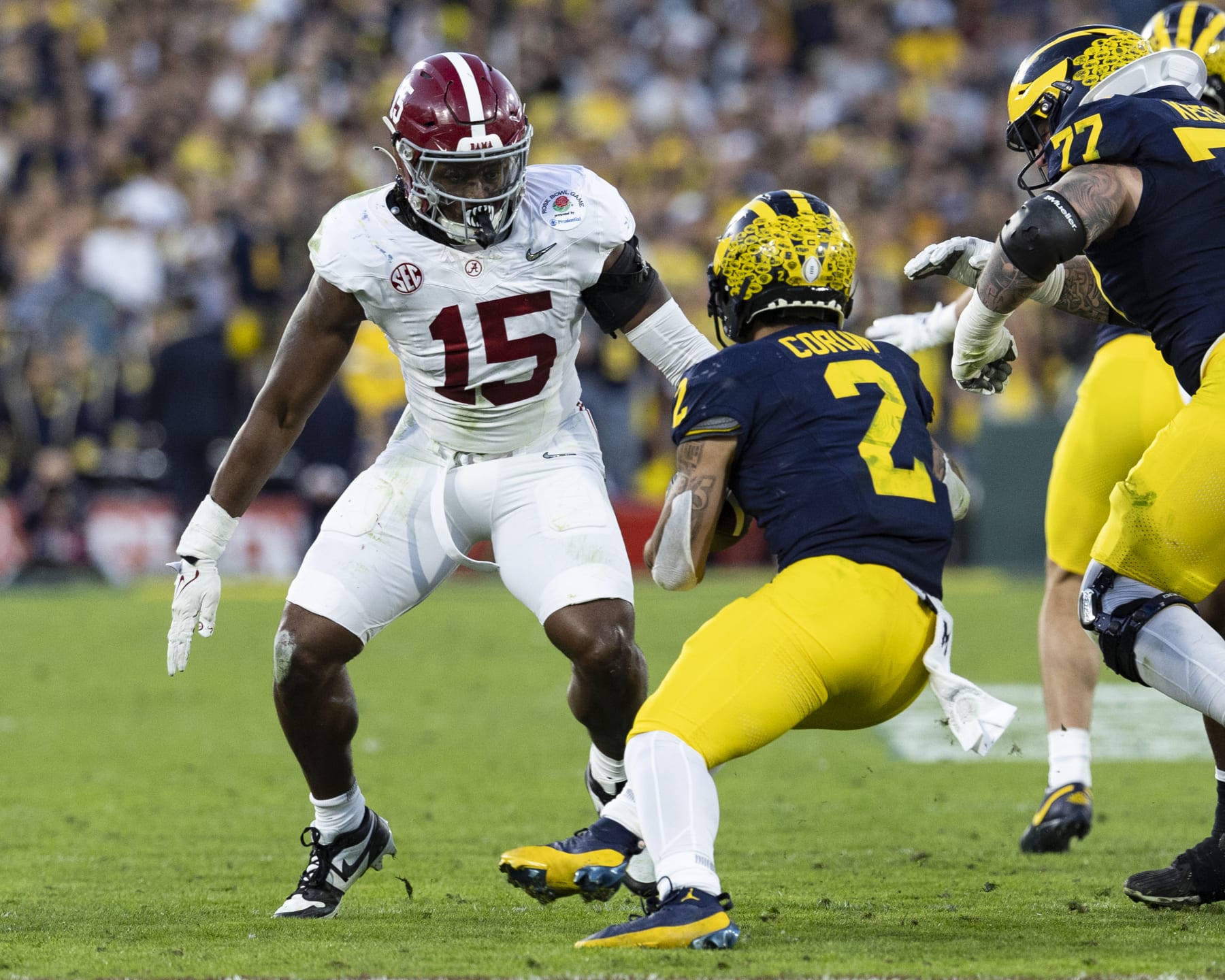PASADENA, CA - JANUARY 1: Dallas Turner #15 of the Alabama Crimson Tide stops Blake Corum #2 of the Michigan Wolverines after a short gain during the Rose Bowl between University of Alabama and University of Michigan at the Rose Bowl on January 1, 2024 in Pasadena, California. (Photo by Steve Limentani/ISI Photos/Getty Images)