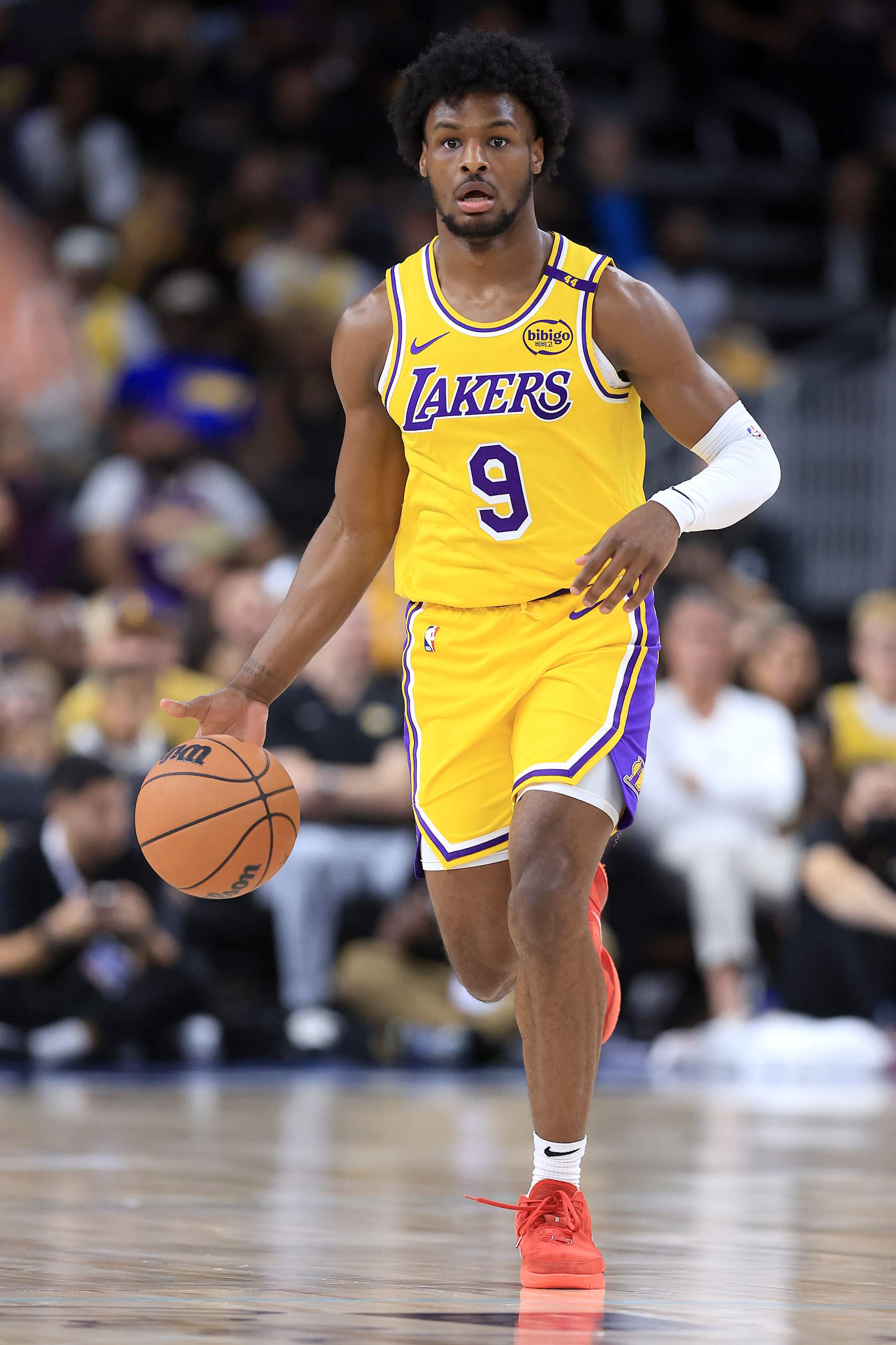 PALM SPRINGS, CALIFORNIA - OCTOBER 04: Bronny James #9 of the Los Angeles Lakers dribbles upcourt during the first half of a game against the Minnesota Timberwolves at Acrisure Arena on October 04, 2024 in Palm Springs, California.  (Photo by Sean M. Haffey/Getty Images)