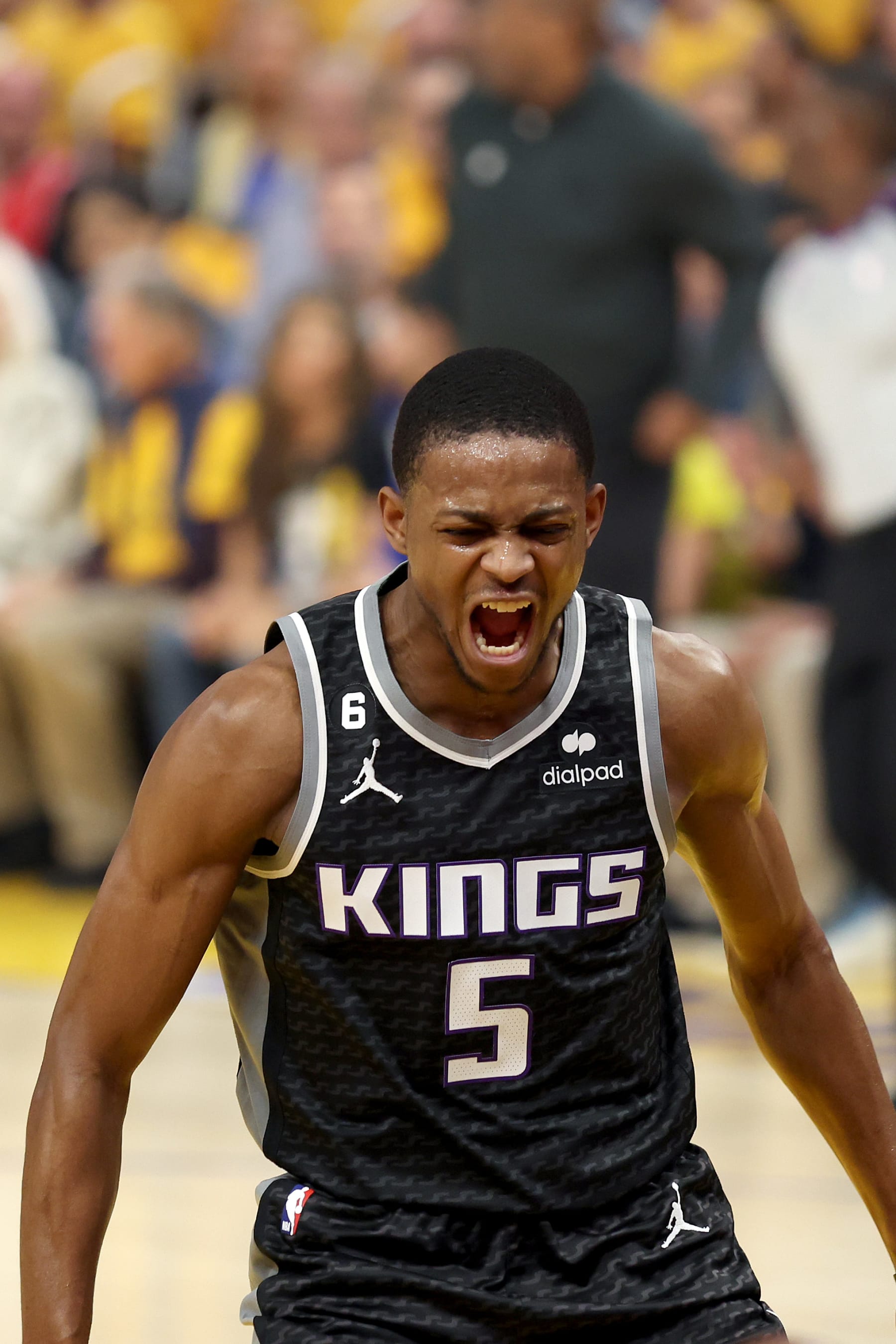 SAN FRANCISCO, CALIFORNIA - APRIL 23: De'Aaron Fox #5 of the Sacramento Kings shoots over Stephen Curry #30 of the Golden State Warriors in the first half of Game Four of the Western Conference First Round Playoffs at Chase Center on April 23, 2023 in San Francisco, California. NOTE TO USER: User expressly acknowledges and agrees that, by downloading and or using this photograph, User is consenting to the terms and conditions of the Getty Images License Agreement. (Photo by Ezra Shaw/Getty Images)