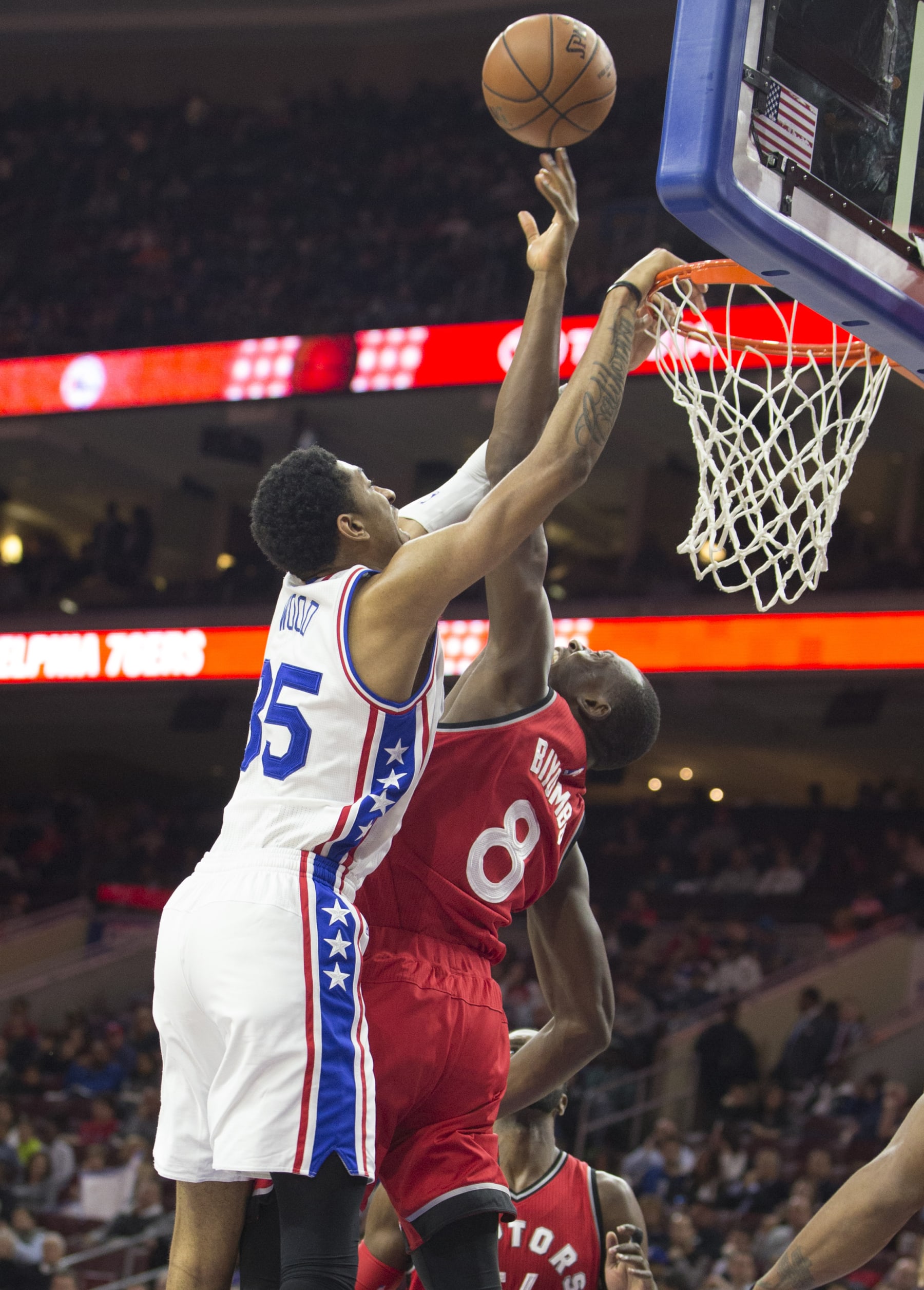 PHILADELPHIA, PA - NOVEMBER 11: Bismack Biyombo #8 of the Toronto Raptors blocks the shot of Christian Wood #35 of the Philadelphia 76ers on November 11, 2015 at the Wells Fargo Center in Philadelphia, Pennsylvania. NOTE TO USER: User expressly acknowledges and agrees that, by downloading and or using this photograph, User is consenting to the terms and conditions of the Getty Images License Agreement. The Raptors defeated the 76ers 119-103. (Photo by Mitchell Leff/Getty Images)