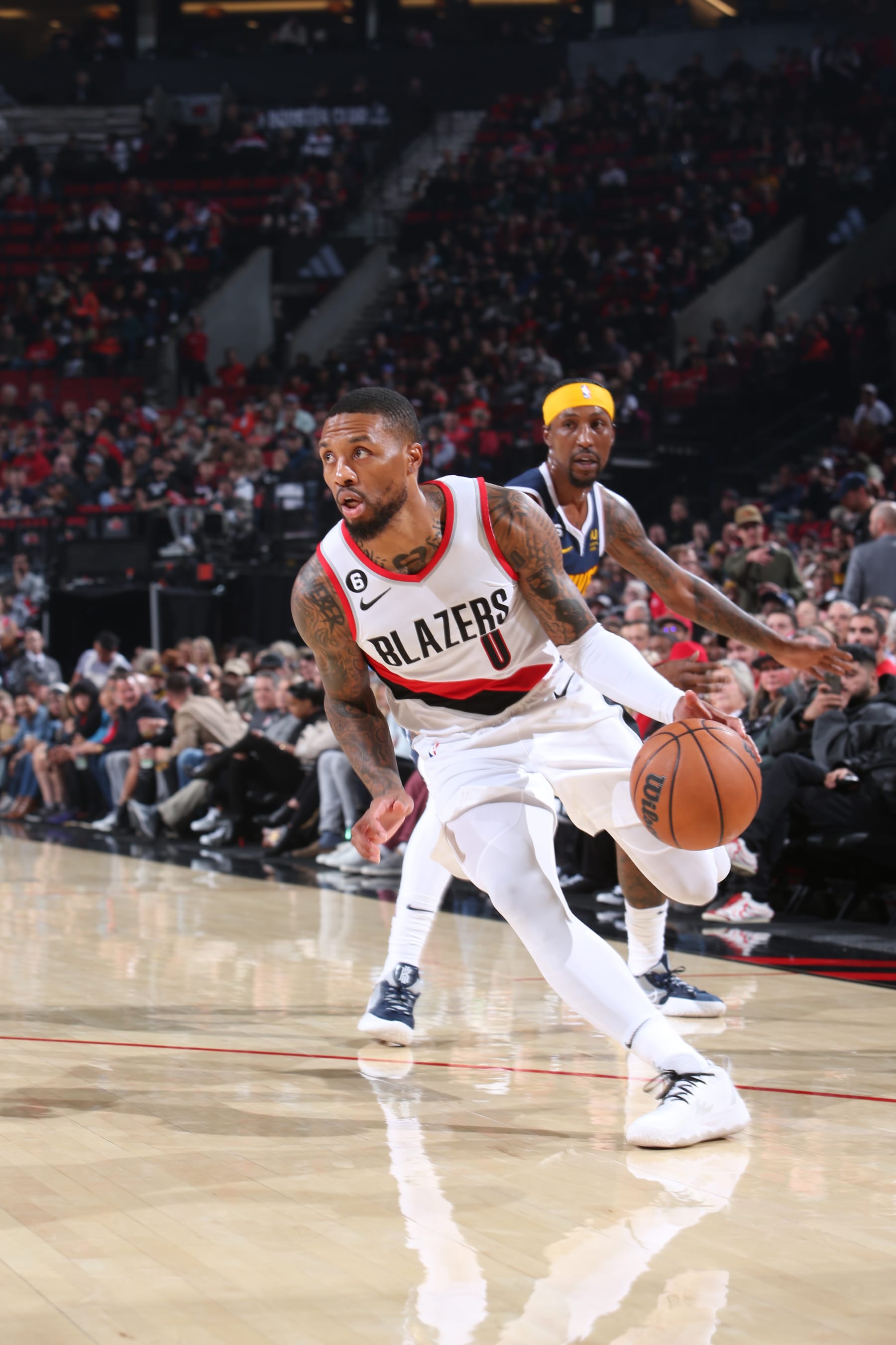 PORTLAND, OR - OCTOBER 24: Damian Lillard #0 of the Portland Trail Blazers drives to the basket during the game against the Denver Nuggets on October 24, 2022 at the Moda Center Arena in Portland, Oregon. NOTE TO USER: User expressly acknowledges and agrees that, by downloading and or using this photograph, user is consenting to the terms and conditions of the Getty Images License Agreement. Mandatory Copyright Notice: Copyright 2022 NBAE (Photo by Sam Forencich/NBAE via Getty Images)