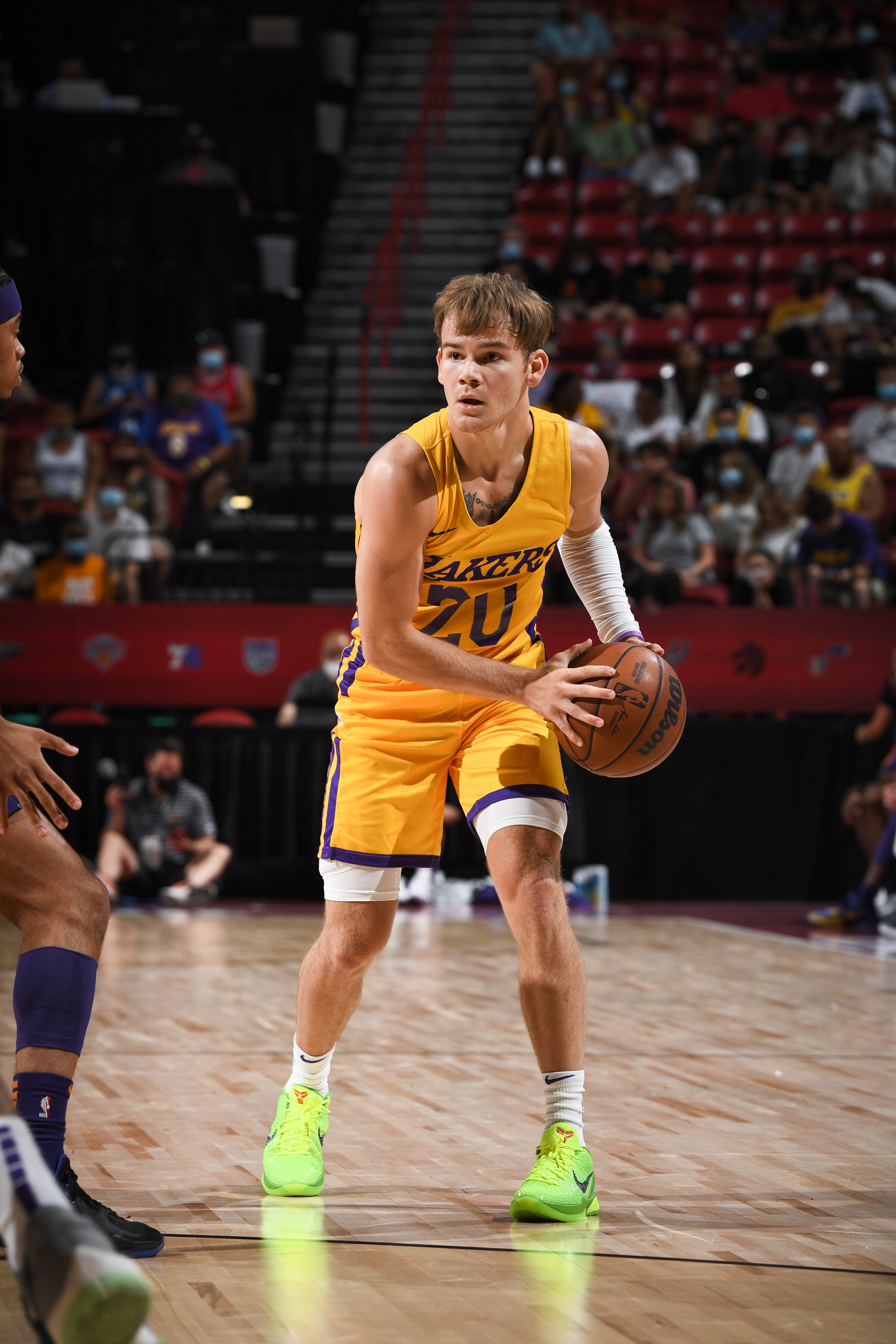 LAS VEGAS, NV - AUGUST 8: Mac McClung #20 of the Los Angeles Lakers looks to pass the ball against the Phoenix Suns during the 2021 Las Vegas Summer League on August 8, 2021 at the Thomas & Mack Center in Las Vegas, Nevada. NOTE TO USER: User expressly acknowledges and agrees that, by downloading and/or using this Photograph, user is consenting to the terms and conditions of the Getty Images License Agreement. Mandatory Copyright Notice: Copyright 2021 NBAE (Photo by Garrett Ellwood/NBAE via Getty Images)