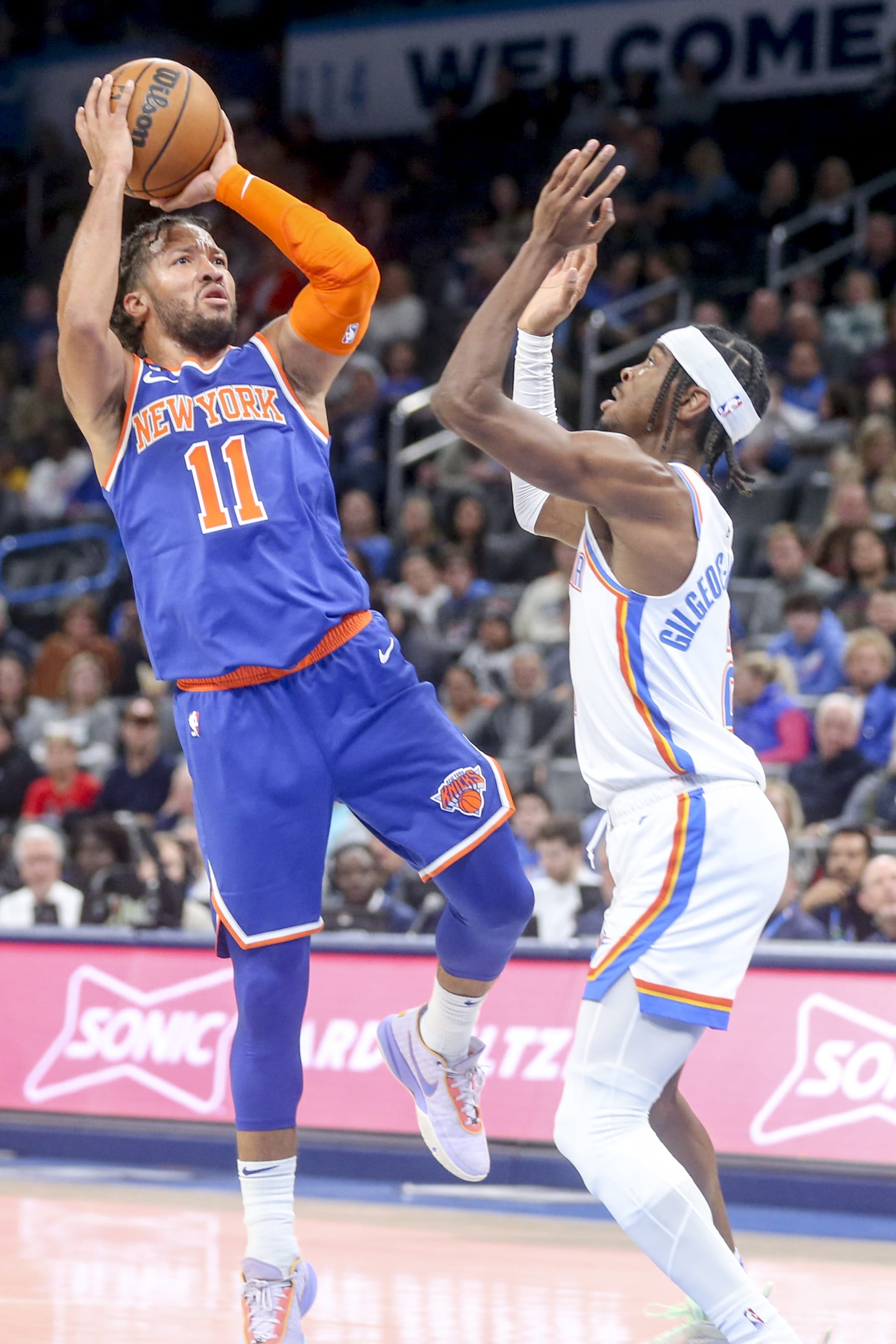 OKLAHOMA CITY, OKLAHOMA - NOVEMBER 21: Jalen Brunson #11 of the New York Knicks shoots over Shai Gilgeous-Alexander #2 of the Oklahoma City Thunder during the third quarter at Paycom Center on November 21, 2022 in Oklahoma City, Oklahoma. NOTE TO USER: User expressly acknowledges and agrees that, by downloading and or using this photograph, User is consenting to the terms and conditions of the Getty Images License Agreement.  (Photo by Ian Maule/Getty Images)