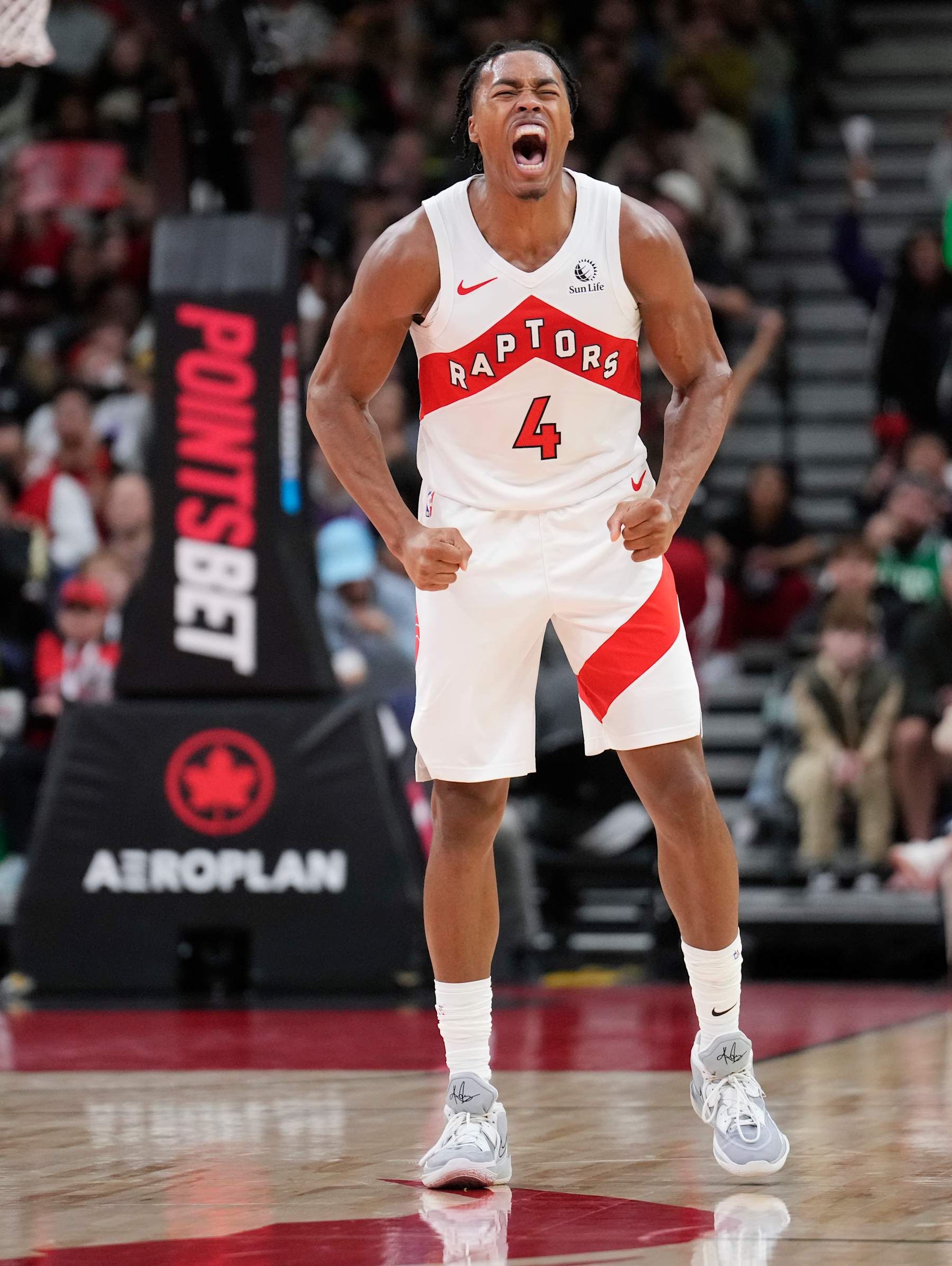 TORONTO, ON - OCTOBER 15: Scottie Barnes #4 of the Toronto Raptors celebrates against the Boston Celtics during the second half of their preseason basketball game at the Scotiabank Arena on October 15, 2024 in Toronto, Ontario, Canada. NOTE TO USER: User expressly acknowledges and agrees that, by downloading and/or using this Photograph, user is consenting to the terms and conditions of the Getty Images License Agreement. (Photo by Mark Blinch/Getty Images)