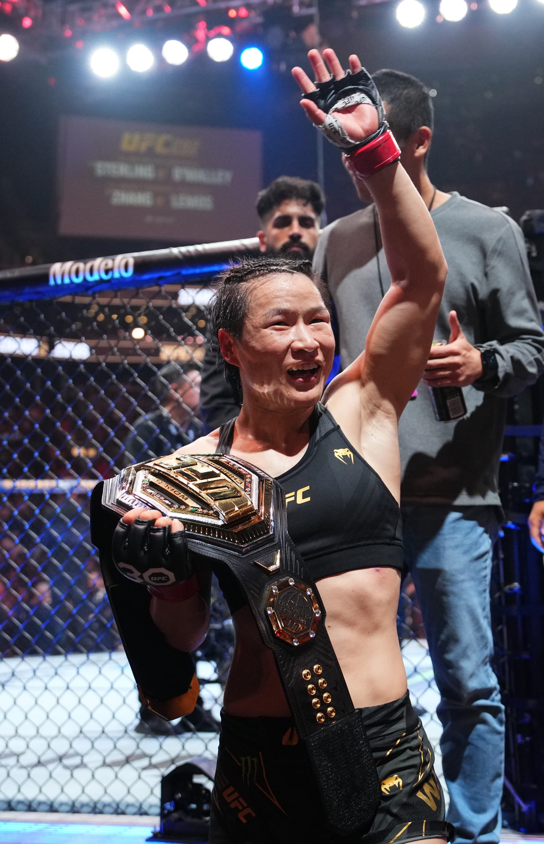 Zhang Weili of China reacts after her victory over Amanda Lemos