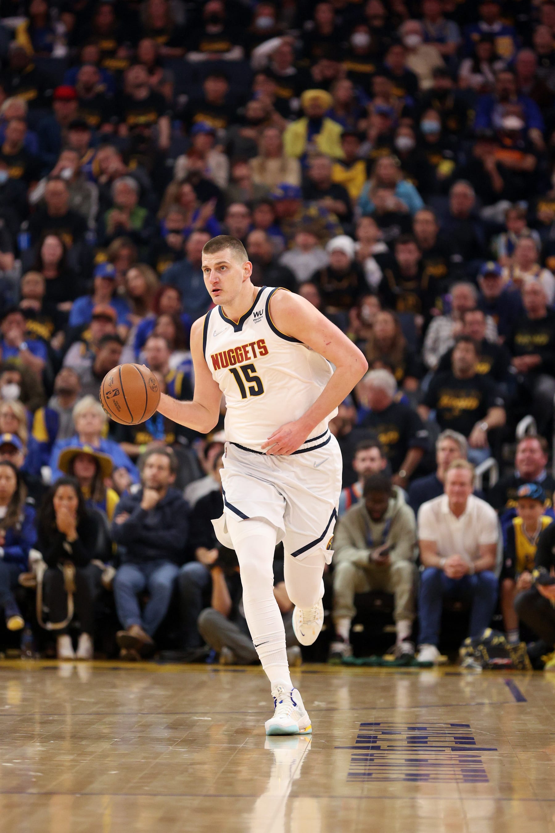 SAN FRANCISCO, CALIFORNIA - APRIL 27:  Nikola Jokic #15 of the Denver Nuggets in action against the Golden State Warriors during Game Five of the Western Conference First Round NBA Playoffs at Chase Center on April 27, 2022 in San Francisco, California. NOTE TO USER: User expressly acknowledges and agrees that, by downloading and/or using this photograph, User is consenting to the terms and conditions of the Getty Images License Agreement.  (Photo by Ezra Shaw/Getty Images)